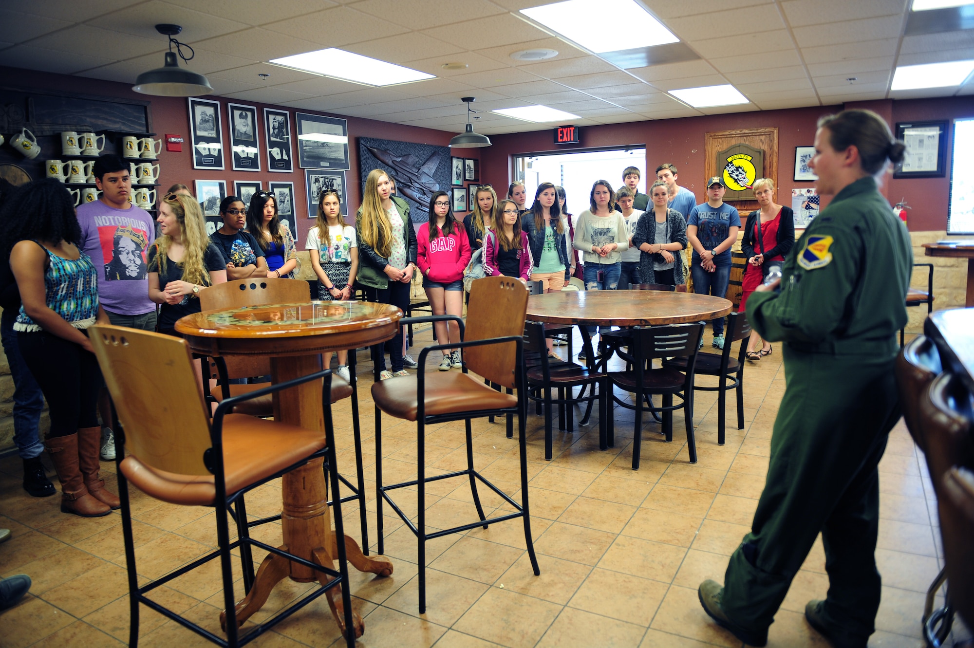 U.S. Air Force 1st Lt. Nikki Yogi, 355 Training Squadron A-10C Thunderbolt II student pilot, speaks to a group of students at Davis-Monthan Air Force Base, Ariz., April 23, 2015. Yogi prepared students from Buena Vista High school and cultural exchange students from Dresden Germany for a tour of the 357th Fighter Squadron where they were educated on the mission of the A-10. (U.S. Air Force photo by Airman 1st Class Cheyenne Morigeau/Released)
