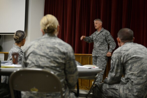 Chief Master Sgt. Gordon Drake, 62nd Airlift Wing command chief, gives a speech to participants of the First Sergeant Symposium, April 23, 2015, at Joint Base Lewis-McChord, Wash. Drake spoke about a few topics, such as the method in selecting first sergeants and then answered questions from the audience. (U.S. Air Force photo/Airman 1st Class Keoni Chavarria)