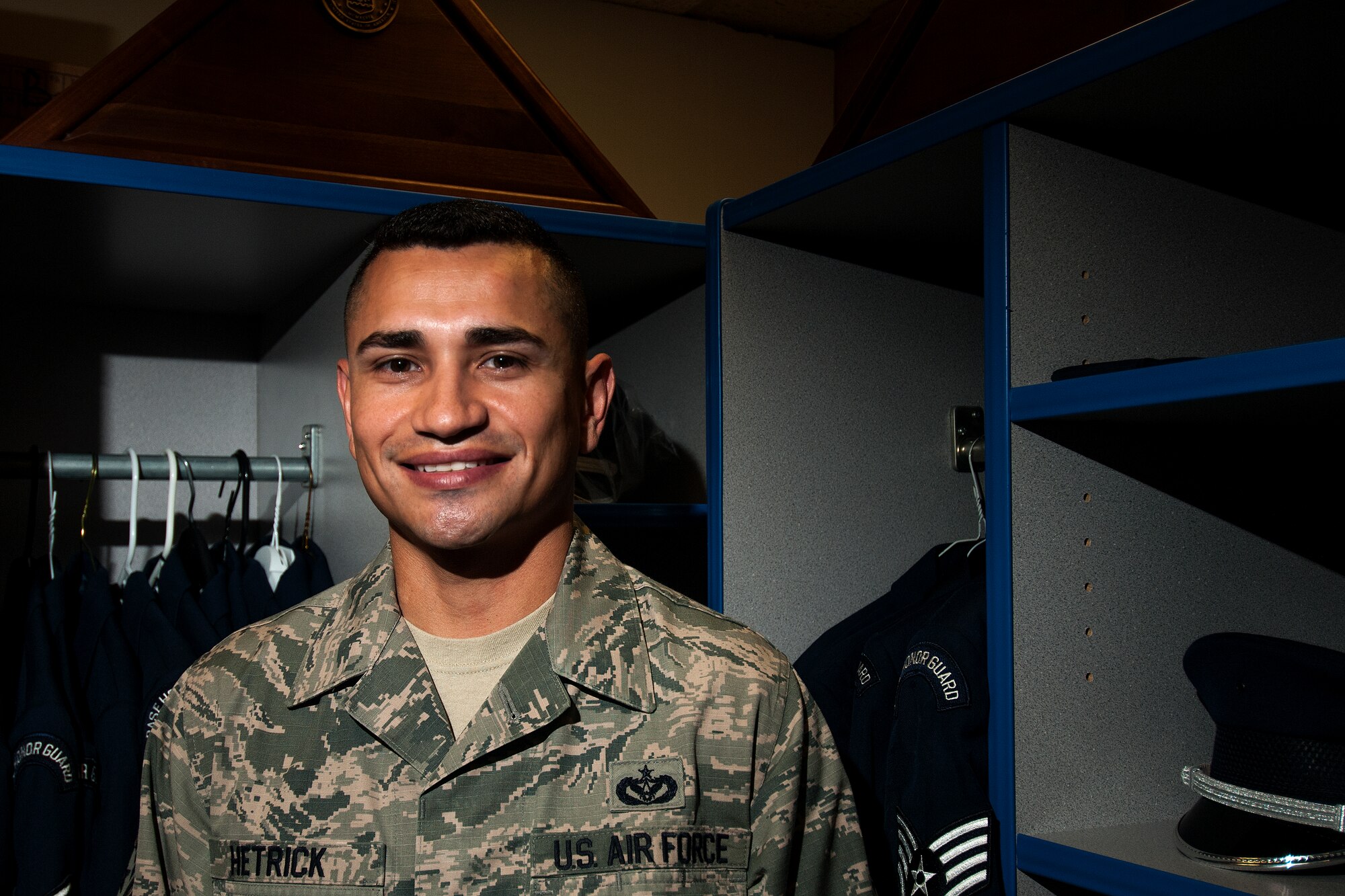 GOODFELLOW AIR FORCE BASE, Texas – Staff Sgt. Albert L. Hetrick, 17th Training Wing Honor Guard NCO in charge, stands in the Honor Guard uniform storage area at Heath Hall April 23. Hetrick is the 2014 Second Air Force Honor Guard Program Manager of the Year awardee and the 2014 Air Education and Training Command Honor Guard Program Manager of the Year. (U.S. Air Force photo/ Senior Airman Scott Jackson)