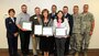 Senior Airman Colton Griffin, a member of the Utah Air National Guard’s 151st Maintenance Squadron, presented a Patriot Award to three of his civilian supervisors at bChannels Inc. in Orem, Utah on April 21, 2015. Dustin Daley, Anne-Marie Mickelsen, and Sue Fahnert were each recognized by the Employer Support of the Guard and Reserve after Griffin nominated them for their outstanding support of his military commitments. As part of the ceremony, bChannels also signed an ESGR Statement of Support expressing its support for employees serving in the Guard and Reserve. (Air National Guard photo by Tech. Sgt. Amber Monio/RELEASED)