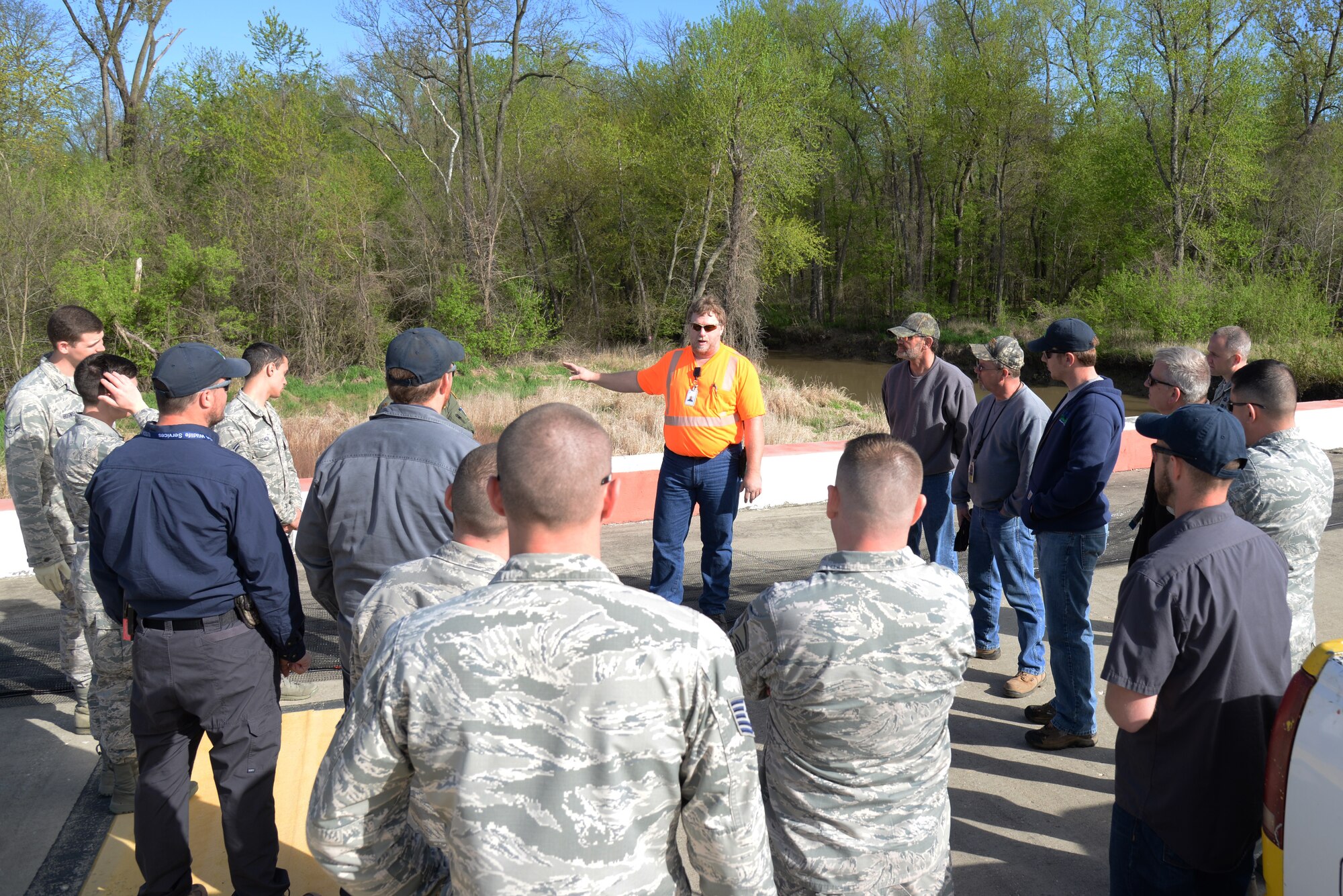 Brian Gieseking speaks to people who are assisting with a wild life exclusion project at Scott Air Force Base, Illinois April 15. The wildlife exclusion projects are done so that aircraft can prevent bird strikes and have them remain safe and functional. Gieseking is the Mid-America Airport Maintenance Superintendent. (U.S. Air Force Photo by Airman 1st Class Megan Friedl)