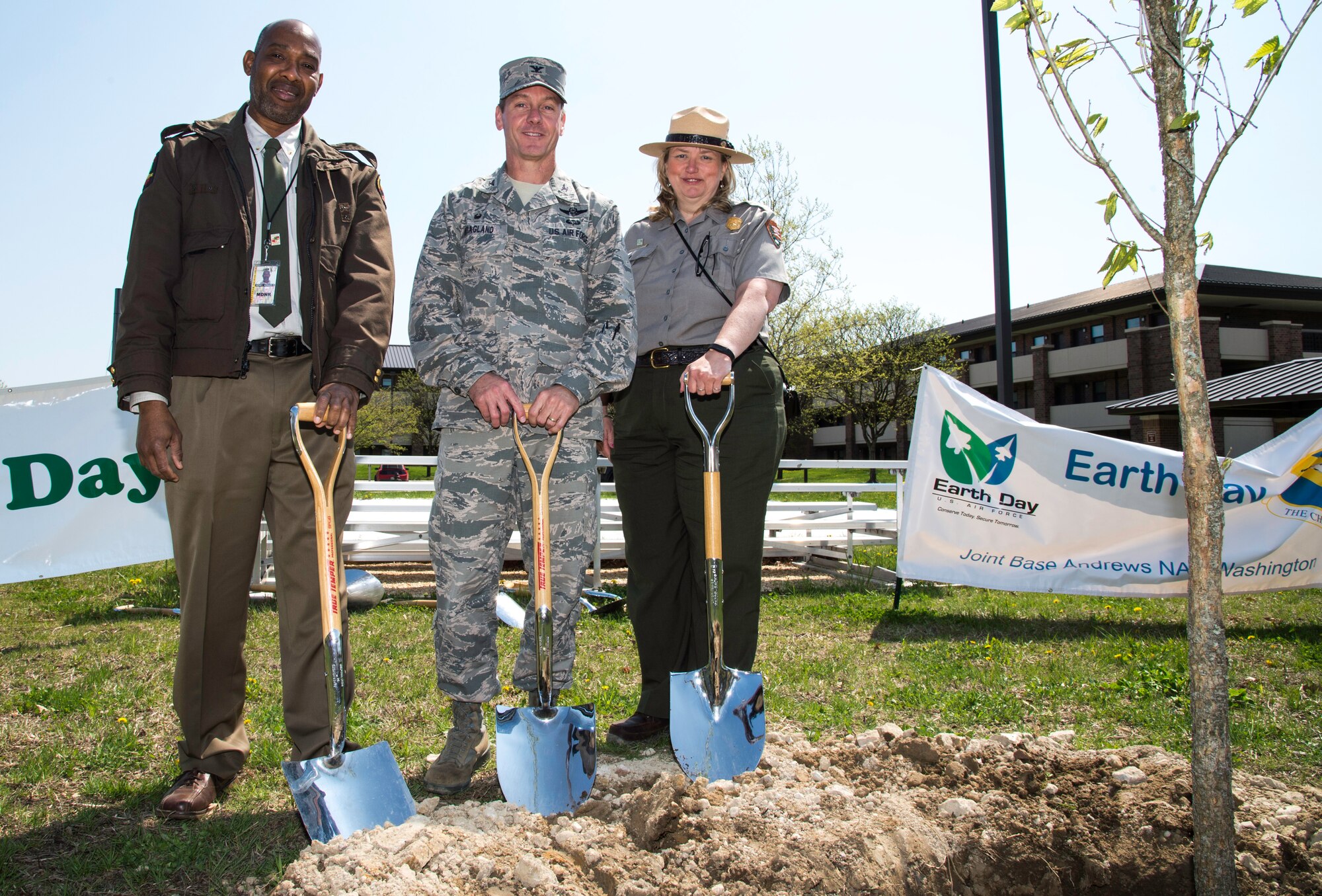 From left to right, Horace Henry, Maryland’s Forestry Service southern region urban and community forestry coordinator, Col. Brad Hoagland, 11th Wing commander, Julie Kutruff, National Capital Parks eastern district manager, commemorate Earth Day and Arbor Day outside Building 1657 at Joint Base Andrews, Md., April 22, 2015. They planted three white oaks, Maryland’s state tree, to signify JBA’s commitment to preserving environmental sustainability. (U.S. Air Force photo/Airman 1st Class Philip Bryant)