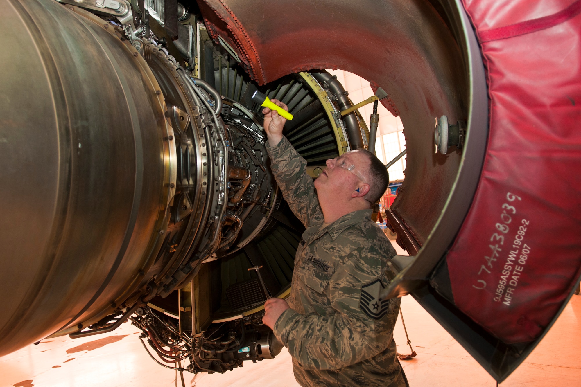 U.S. Air Force Master Sgt. Mark Rawlins, crew chief, 121st Air Refueling Wing, performs an inspection on a KC-135 Stratotanker during depot maintenance as part of Operation Team Spirit, Tinker Air Force Base, Okla., Mar. 2, 2015. The program teams up unit maintenance Airmen with depot facility personnel to perform inspections on aircraft as part of the depot maintenance process. (U.S. Air National Guard photo by Senior Airman Wendy Kuhn/Released)