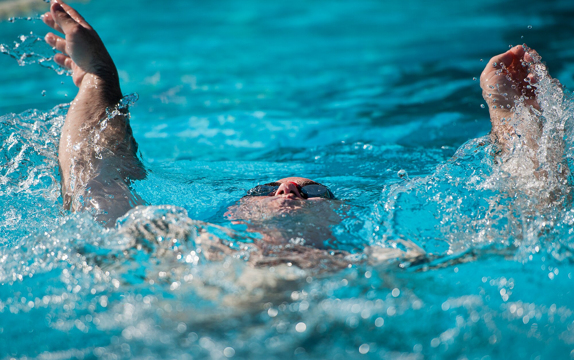 Jason Caswell, an Air Force Wounded Warrior athlete, swims laps during the fourth day of the Warrior Games training camp at Eglin Air Force Base, Fla., April 21. The five-day training camp for the Air Force’s athletes serves as their last practice session before the Warrior Games June 19-28. (U.S. Air Force photo/Samuel King Jr.)