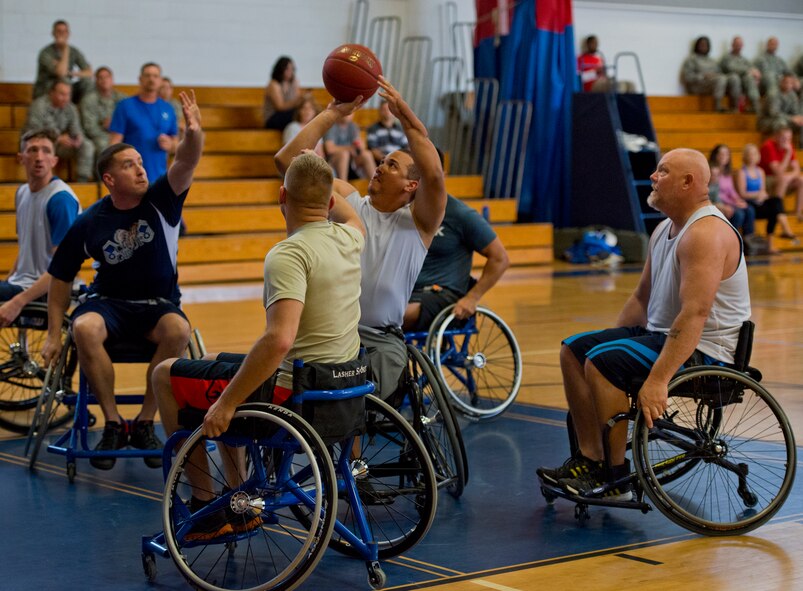 Brian Williams takes a shot at the goal at a wheelchair basketball game with base leadership during the final day of the Warrior Games training camp at Eglin Air Force Base, Fla., April 22. The five-day training camp for the Air Force’s athletes serves as their last practice session before the Warrior Games June 19-28. (U.S. Air Force photo/Samuel King Jr.)