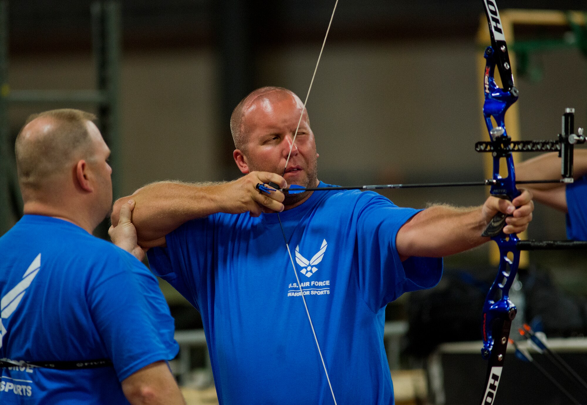 Craig Zaleski, an Air Force Wounded Warrior athlete, receives instruction about his form at the last archery session during the final day of the Warrior Games training camp at Eglin Air Force Base, Fla., April 22. The five-day training camp for the Air Force’s athletes serves as their last practice session before the Warrior Games June 19-28. (U.S. Air Force photo/Samuel King Jr.)