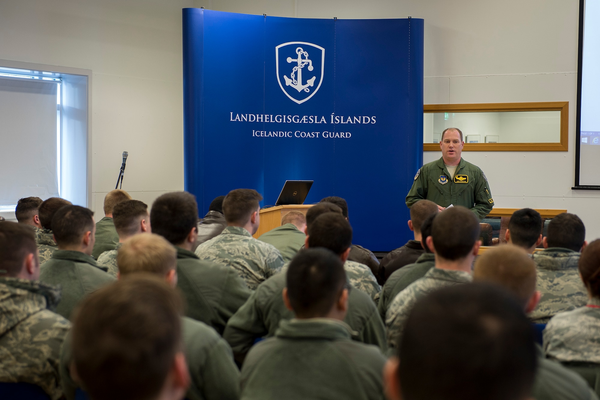U.S. Air Force Lt. Col. John Stratton, 871st Air Expeditionary Squadron commander, speaks to deployed personnel at Keflavik, Iceland, in support of Icelandic Air Surveillance and Policing operations April 13, 2015. Four F-15C Eagle fighter aircraft from Royal Air Force Lakenheath, a KC-135 Stratotanker from RAF Mildenhall and approximately 200 U.S Airmen are deployed in support of IAS 2015 to ensure the safety and security of Icelandic airspace. (U.S. Air Force photo by Staff Sgt. Chad Warren/Released)