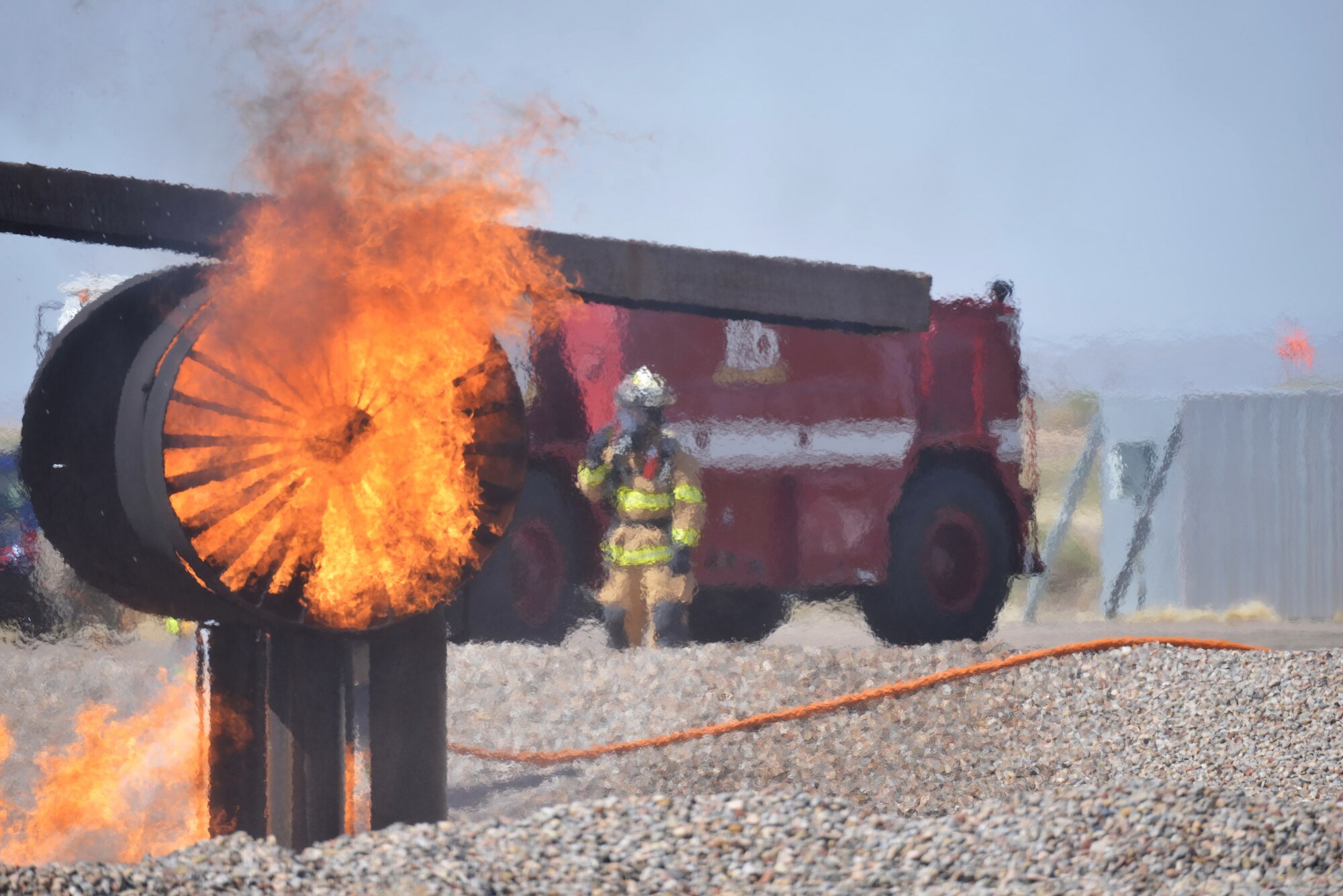 The Kirtland Air Force Base Fire Department joined with civilian departments on April 15 to practice battling a fire in and around a crashed aircraft. (Photo by Jamie Burnett)