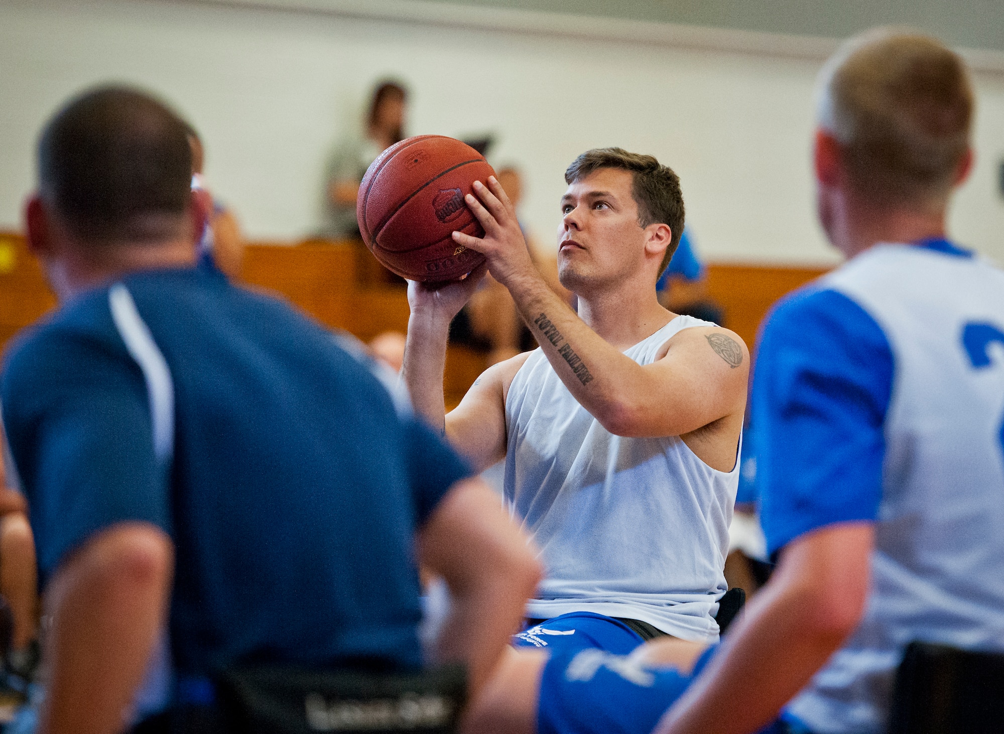 Master Sgt. Chris Ramakka, an active-duty Air Force Wounded Warrior athlete, aims a foul shot at a wheelchair basketball game with base leadership during the final day of the Warrior Games training camp at Eglin Air Force Base, Fla., April 22. The five-day training camp for the Air Force’s athletes serves as their last practice session before the Warrior Games June 19-28. (U.S. Air Force photo/Samuel King Jr.)