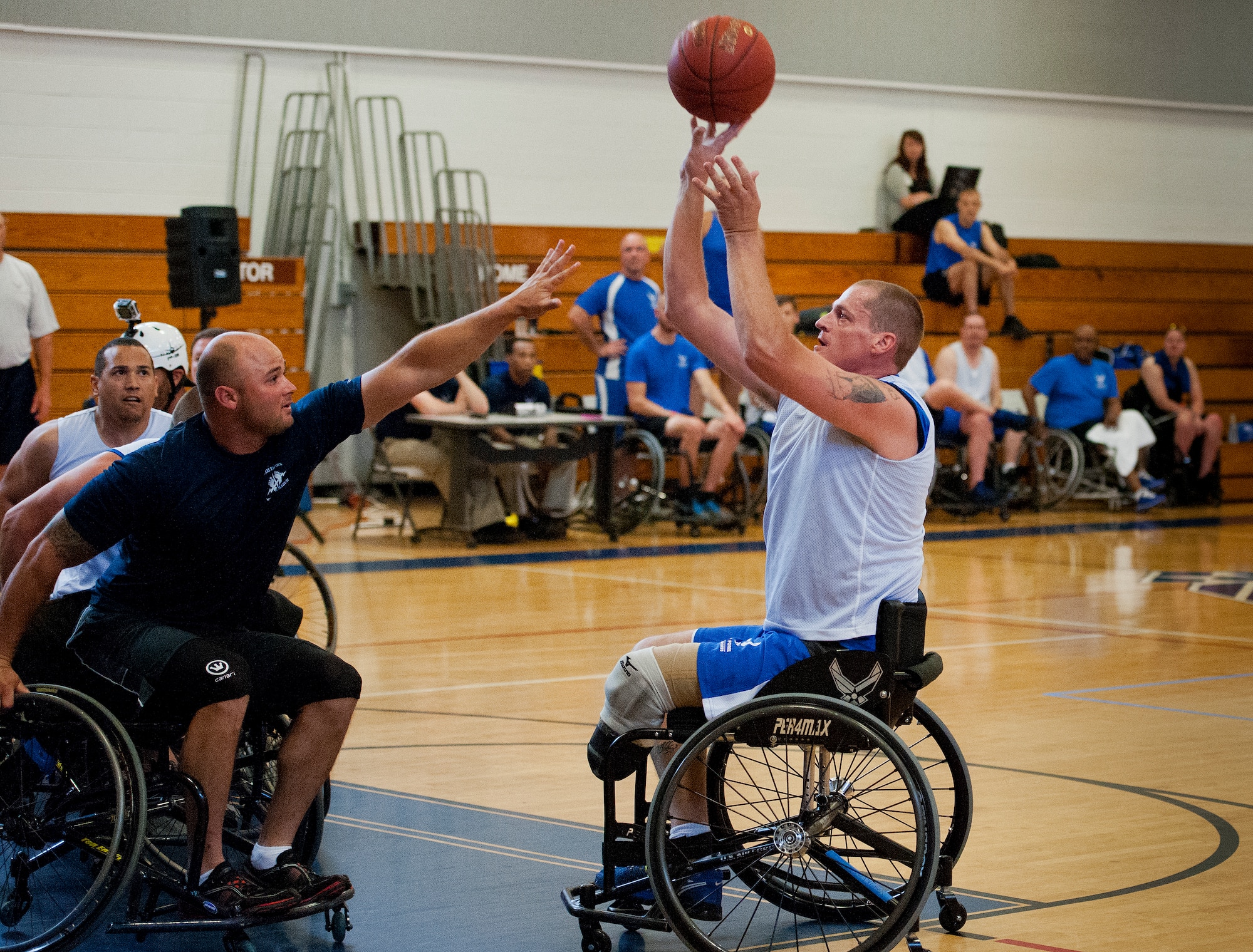Patrick Young, an Air Force Wounded Warrior athlete, takes a shot at a wheelchair basketball game with base leadership during the final day of the Warrior Games training camp at Eglin Air Force Base, Fla., April 22. The five-day training camp for the Air Force’s athletes serves as their last practice session before the Warrior Games June 19-28. (U.S. Air Force photo/Samuel King Jr.)