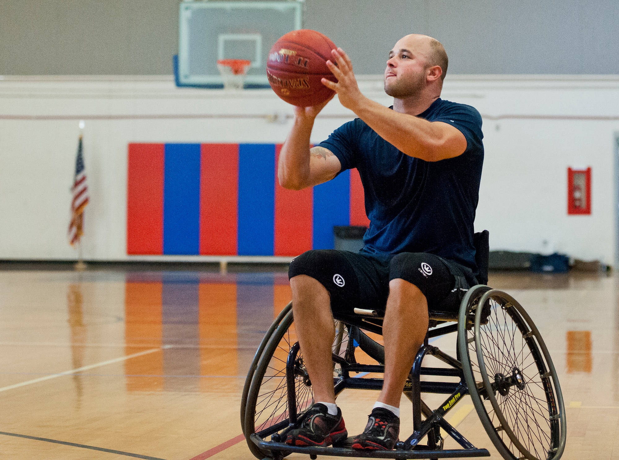 E.J. Newbern, an Air Force Wounded Warrior athlete, aims his shot at a wheelchair basketball game with base leadership during the final day of the Warrior Games training camp at Eglin Air Force Base, Fla., April 22. The five-day training camp for the Air Force’s athletes serves as their last practice session before the Warrior Games June 19-28. (U.S. Air Force photo/Samuel King Jr.)