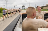 Tactical Air Control Party (TACP) students from the 342nd Training Squadron, who have fallen out of the group run, ride with a medic April 4 at Joint Base San Antonio-Lackland. The Airmen will be a part of the first class to attend the TACP level-three apprentice course at JBSA-Lackland. The apprentice course was relocated from Hulburt Field Air Force Base, Florida. (U.S. Air Force photo by Airman First Class Justine Rho/released)