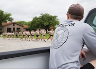 A Tactical Air Control Party (TACP) instructor from the 342nd Training Squadron at Joint Base San Antonio-Lackland, oversees students during a group run. The Airmen will be a part of the first class to attend the TACP level-three apprentice course at JBSA-Lackland. The apprentice course was relocated from Hulburt Field Air Force Base, Florida. (U.S. Air Force photo by Airman First Class Justine Rho/released)