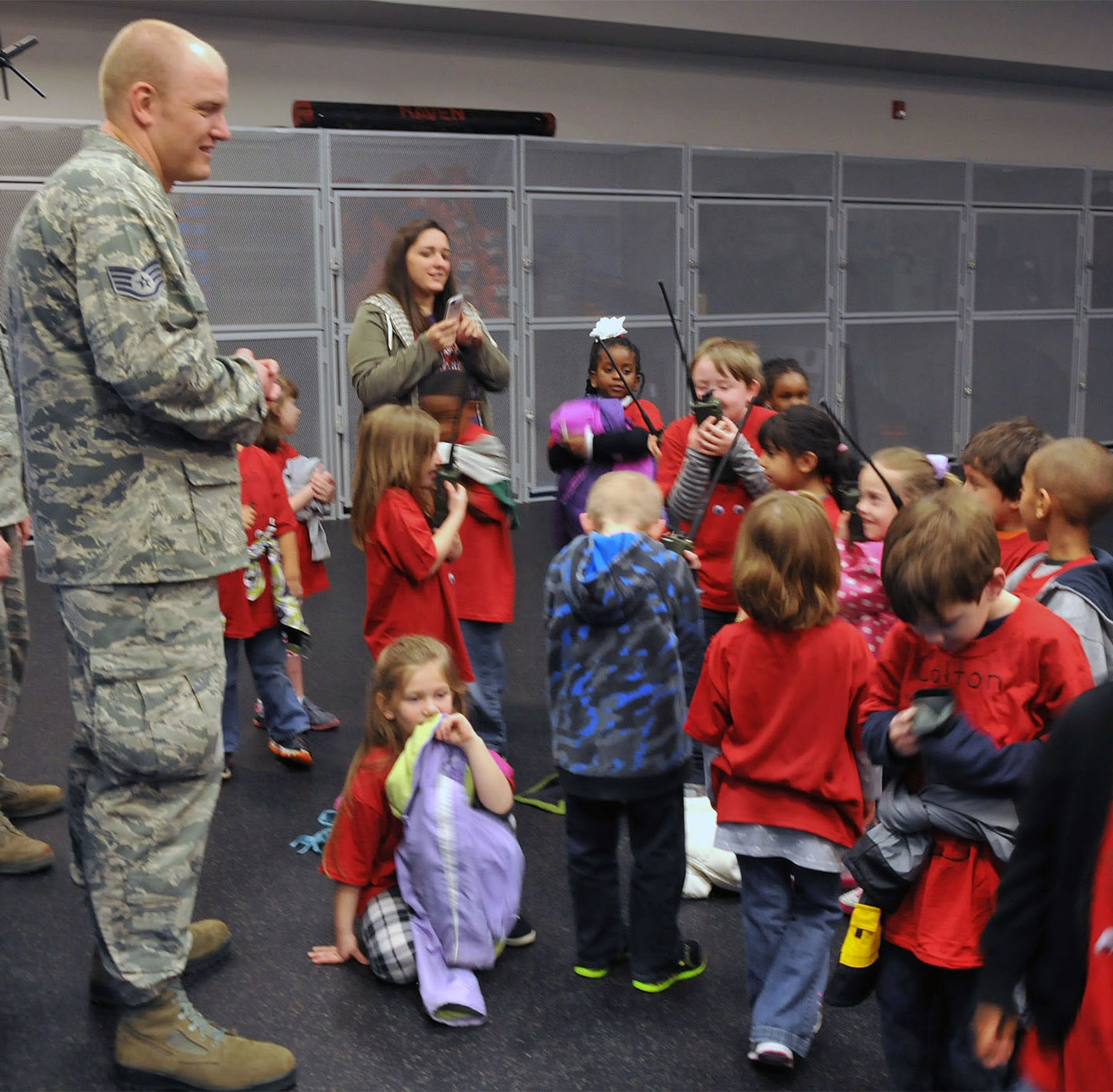 Staff Sgt. Corey Shaffer talks with students ."The New Jersey Discovery School toured the U.S. Air Force Expeditionary Center and visited with Airmen on Joint Base McGuire-Dix-Lakehurst, NJ on 17 April 2015."