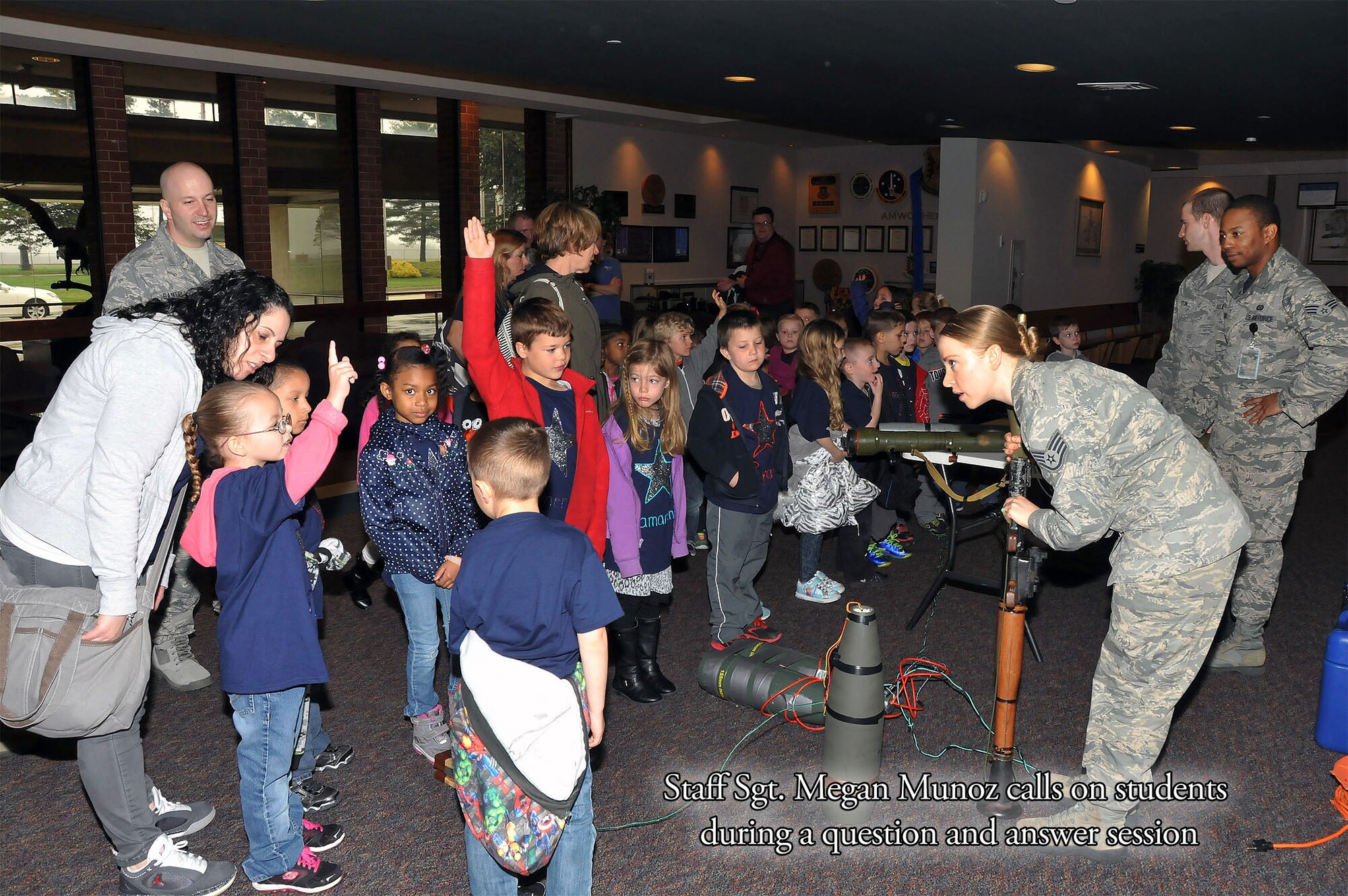 Staff Sgt. Meagan Munoz call on students. "The New Jersey Discovery School toured the U.S. Air Force Expeditionary Center and visited with Airmen on Joint Base McGuire-Dix-Lakehurst, NJ on 17 April 2015."