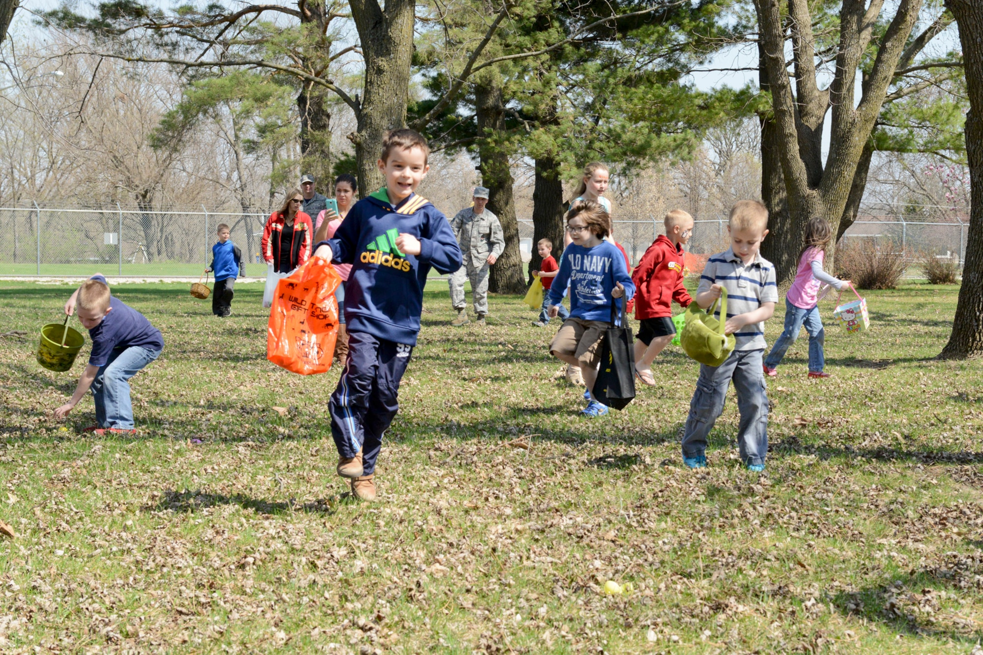 Members of the 132nd Wing (132WG), Des Moines, Iowa and their families participate in the 2015 Annual Easter Egg Hunt held outside of the Dining Facility of the 132WG on Saturday, April 11, 2015.  (U.S. Air National Guard photo by Tech. Sgt. Michael B. McGhee/Released)