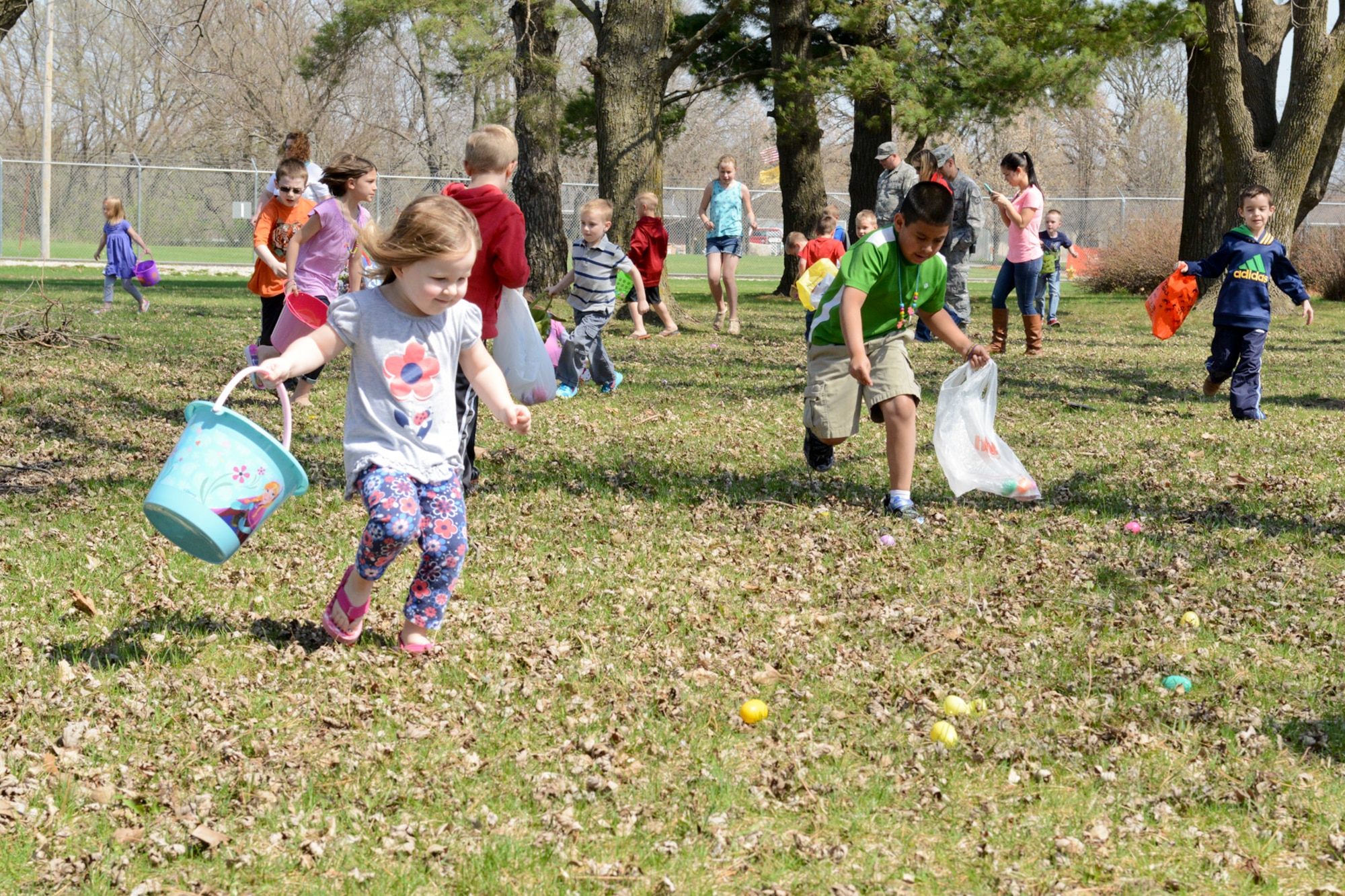 Members of the 132nd Wing (132WG), Des Moines, Iowa and their families participate in the 2015 Annual Easter Egg Hunt held outside of the Dining Facility of the 132WG on Saturday, April 11, 2015.  (U.S. Air National Guard photo by Tech. Sgt. Michael B. McGhee/Released)