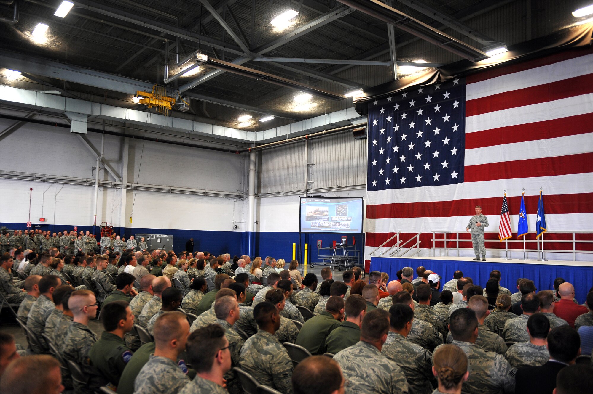 U.S. Air Force Gen. Hawk Carlisle, commander of Air Combat Command, addresses members of Team Offutt during a commander’s call April 21, 2015 inside a hangar at Offutt Air Force Base, Nebraska. Carlisle visited Offutt April 20-21 where he toured the base and met with Airmen at various units. (U.S. Air Force photo by Josh Plueger/Released)