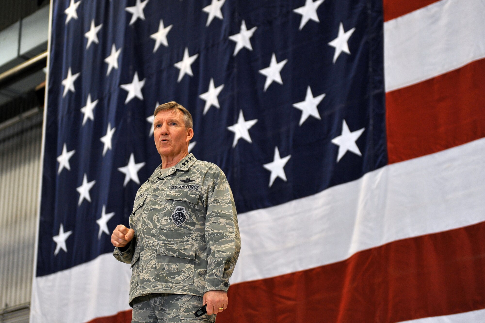 U.S. Air Force Gen. Hawk Carlisle, commander of Air Combat Command, addresses members of Team Offutt during a commander’s call April 21, 2015 inside a hangar at Offutt Air Force Base, Nebraska. Carlisle visited Offutt April 20-21 where he toured the base and met with Airmen at various units. (U.S. Air Force photo by Josh Plueger/Released)