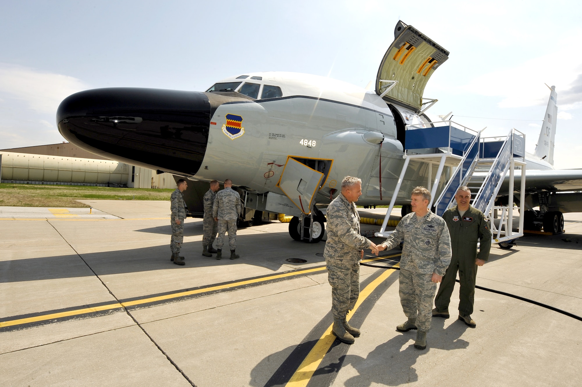 U.S. Air Force Gen. Hawk Carlisle, commander of Air Combat Command, is greeted by U.S. Air Force Col. David Carlson, 55th Maintenance Group commander, following a tour of an RC-135 Rivet Joint with U.S. Air Force Col. Mark Williamson, 55th Wing vice commander, at Offutt Air Force Base, Nebraska April 21, 2015. Carlisle visited Offutt April 20-21 to see Offutt’s mission first hand and to discuss ACC priorities with Airmen.  (U.S. Air Force photo by Josh Plueger/Released)