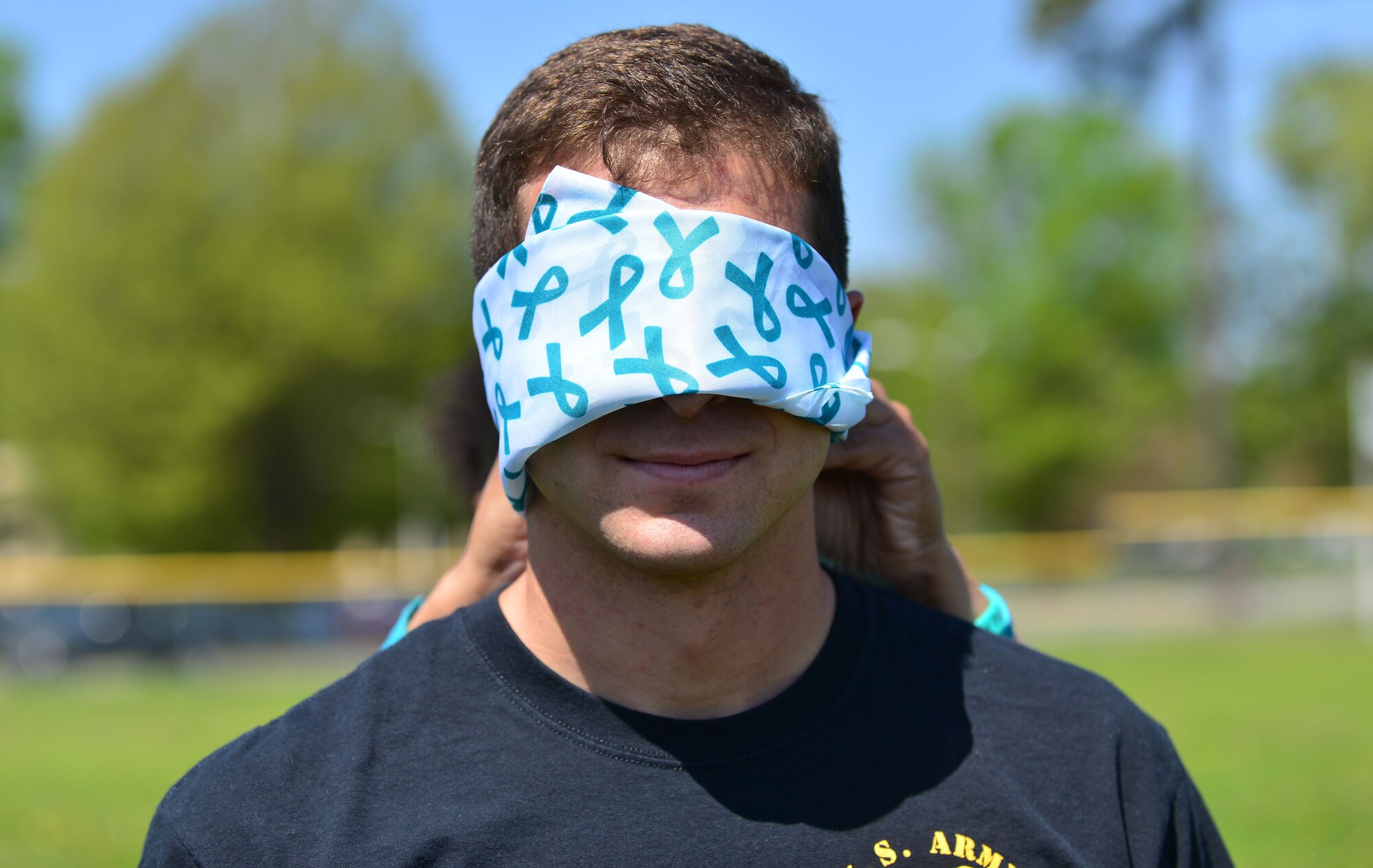 U.S. Army 1st Lt. Ayman Andrews, 20th Engineer Brigade, 30th Engineer Battalion, and 86th Engineer Detachment (Dive) dive officer, is blind folded for a team building exercise during the “Carry the Load” competition at Fort Eustis, Va., April 22, 2014. The event featured five team building stations that emphasize the importance of working as a team to get through problems or issues rather than facing them alone. (Photo by U.S. Air Force Staff Sgt. Natasha Stannard/Released)