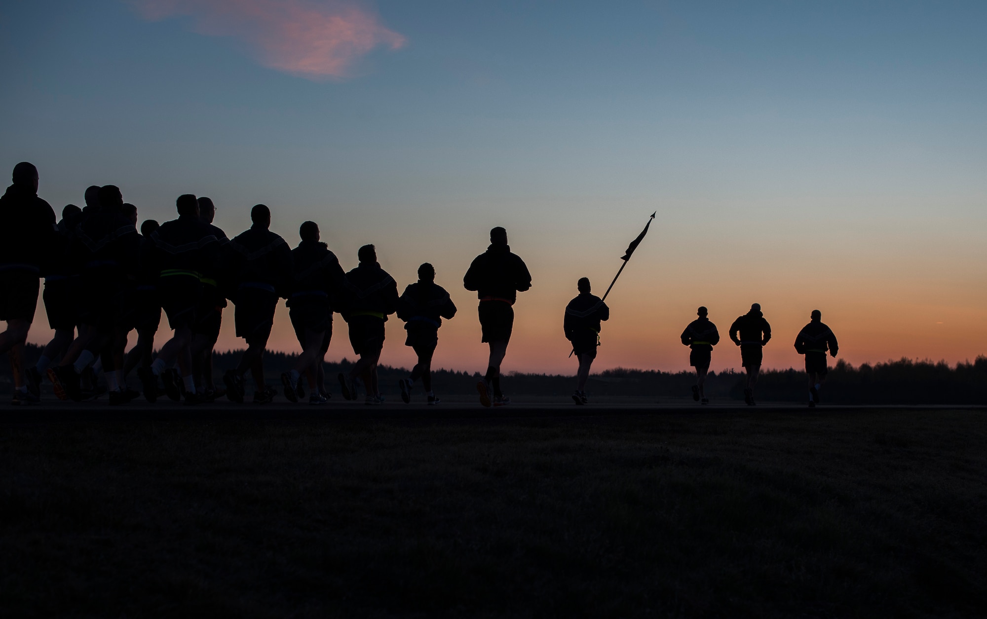 Instructors and students of a Fly Away Security course participate in a three-mile run prior to graduation Feb. 18, 2015, at Ramstein Air Base, Germany. After completing the ten-day pre-deployment course, the defenders are now ready to be deployed throughout the world, protecting aircrew and aircraft in austere locations. (U.S. Air Force photo/Senior Airman Damon Kasberg)