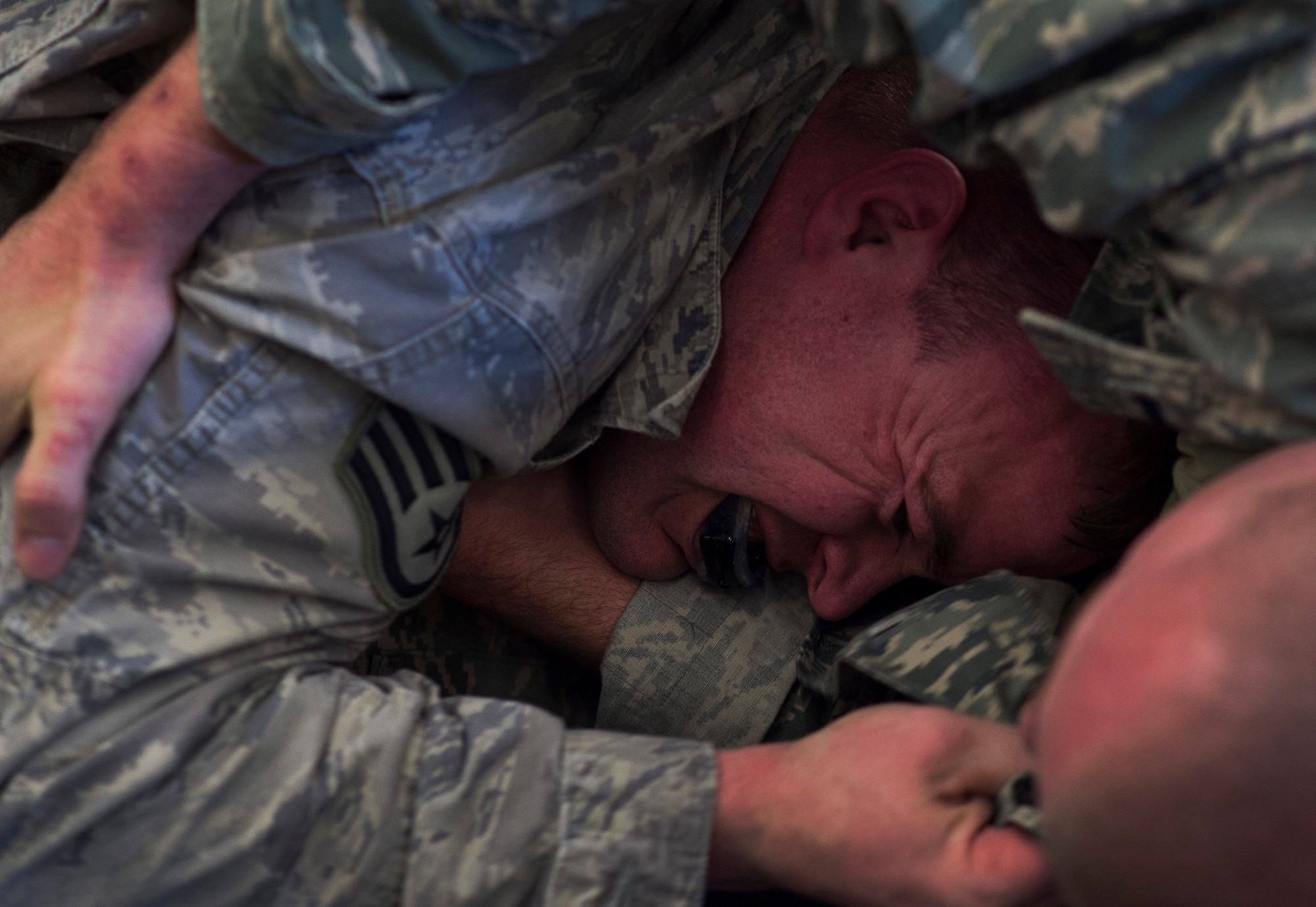 Staff Sgt. Ryan Friend, 569th U.S. Forces Police Squadron installation patrolman, and 1st Lt. John Newman, 435th Security Forces Squadron ground combat readiness training center OIC, spar against each other during a Fly Away Security course Feb. 14, 2015, at Ramstein Air Base, Germany. The ten-day pre-deployment course teaches defenders how to protect airframes and aircrews and also focuses on communication, hand-to-hand combat and basic mission planning techniques. (U.S. Air Force photo/Senior Airman Damon Kasberg)