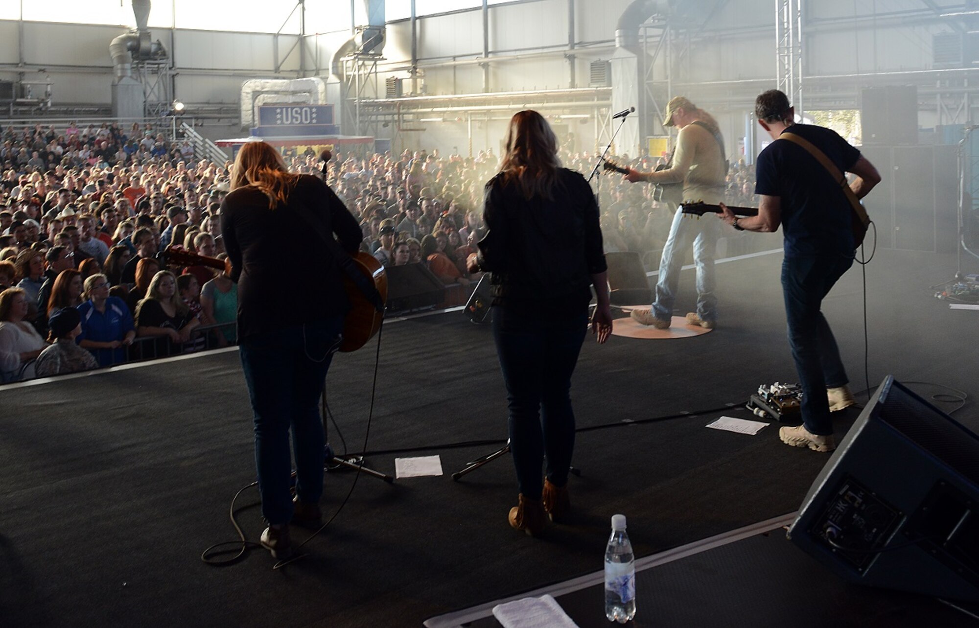 Trace Adkins, country music singer, and his band perform during a USO concert April 20, 2015, at Ramstein Air Base, Germany. Adkins has performed for over 40,000 troops and their families during 10 USO tours in seven countries. (U.S. Air Force photo/Airman 1st Class Tryphena Mayhugh)