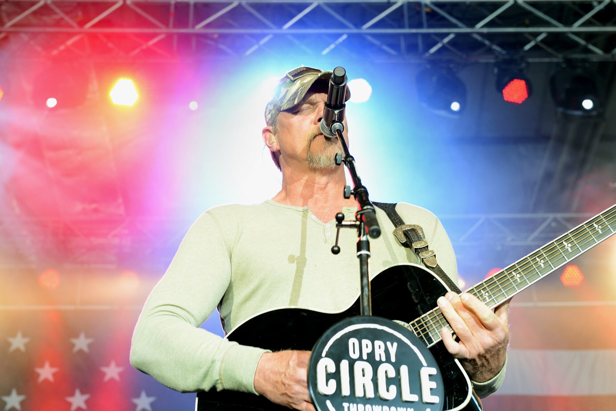 Trace Adkins, country music singer, performs during a USO concert April 20, 2015, at Ramstein Air Base, Germany. Adkins is celebrating the Grand Ole Opry’s 90th anniversary during a ten-day USO tour and is performing on a replica of the six-foot circle of wood that sits center stage at the Grand Ole Opry House. (U.S. Air Force photo/Airman 1st Class Tryphena Mayhugh)