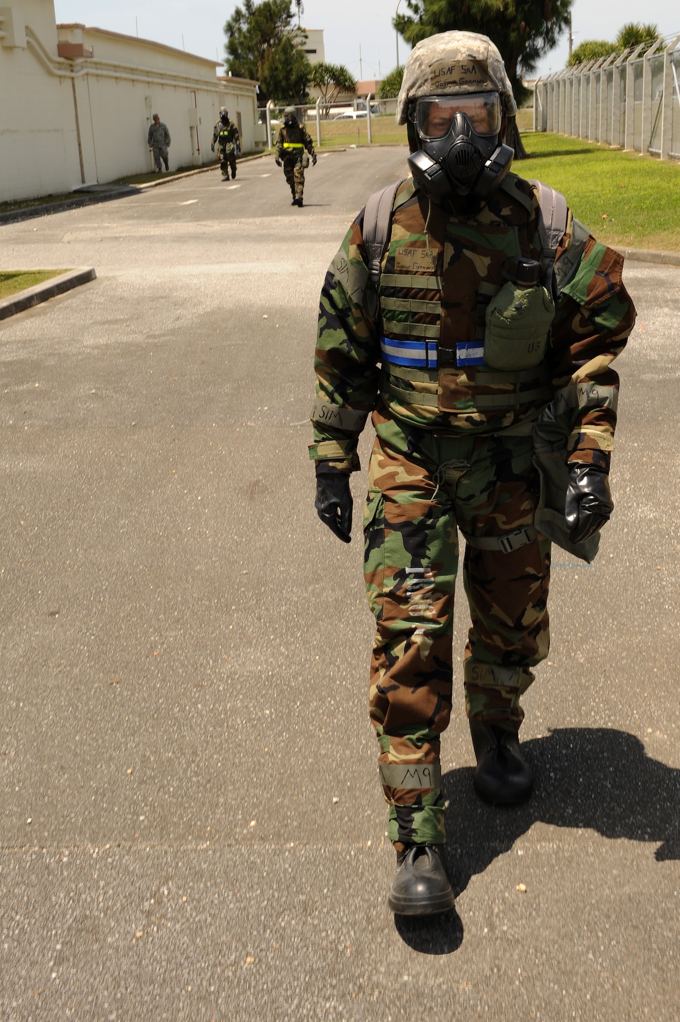 U.S. Air Force Senior Airman Joshua Germano, 18th Communications Squadron cyber operations technician, leads a simulated post-attack reconnaissance sweep following a simulated chemical attack on Kadena Air Base, Japan, April 23, 2015. PAR sweeps are conducted in order to determine whether or not a facility has been contaminated by chemical weapons. They are conducted by personnel in full mission-oriented protective posture gear in order to ensure they remain safe in the event there are hazardous chemicals in the environment. (U.S. Air Force photo by Airman 1st Class Zade C. Vadnais)