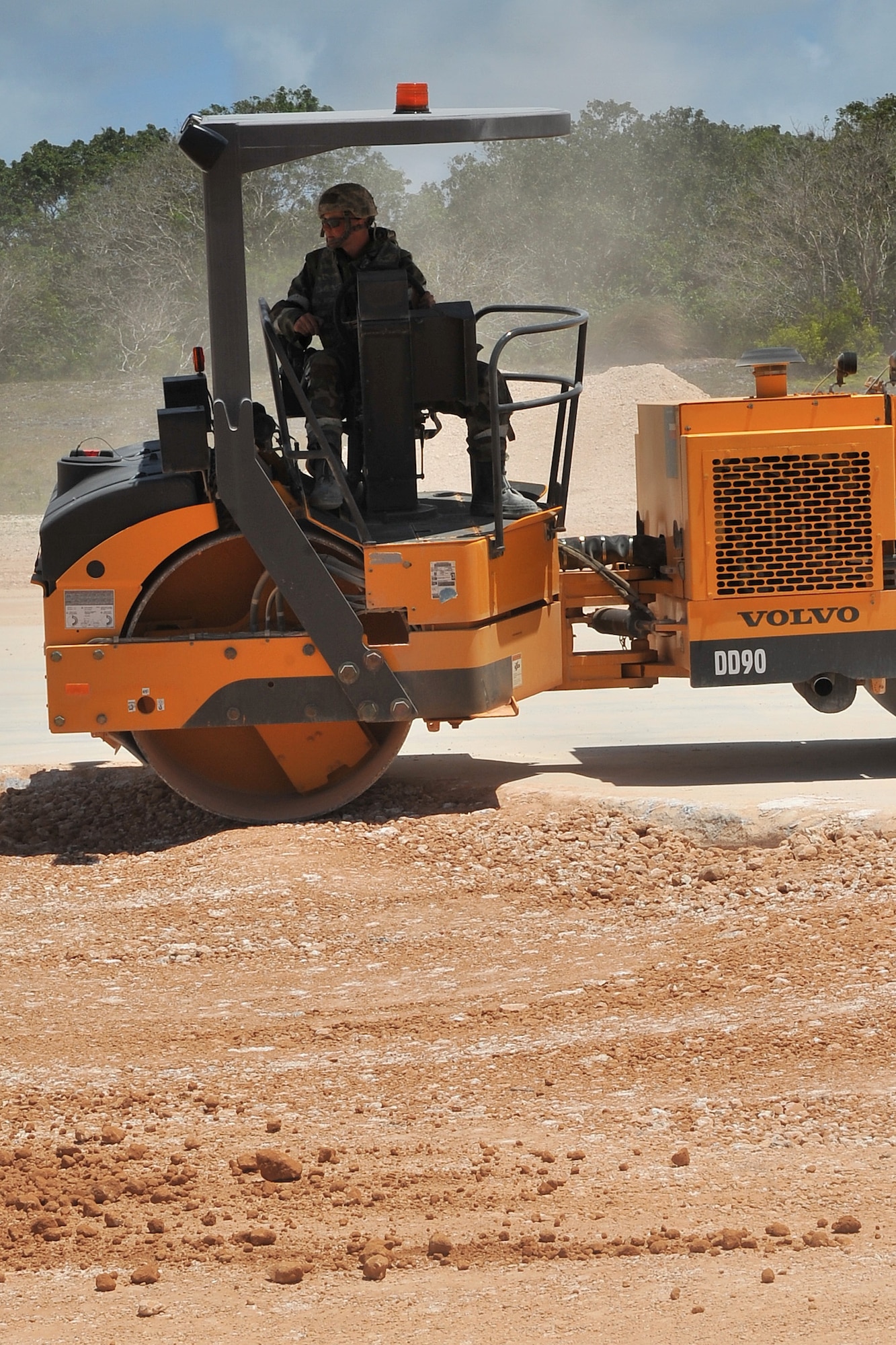 Airman 1st Class Jeremy Clapham, 773rd Civil Engineer Squadron pavement and equipment operator, repairs a crater during airfield damage repair training at the Pacific Air Forces’ Silver Flag site on Northwest Field, Guam, April 21, 2015. Airmen throughout PACAF participate in Silver Flag to exercise various expeditionary skills including ADR, where engineers provide a rapid, semi-permanent repair during combat operations to allow airfield operations to resume quickly. Clapham is assigned to Joint Base Elmendorf-Richardson, Alaska. (U.S. Air Force photo by Staff Sgt. Melissa B. White/Released)