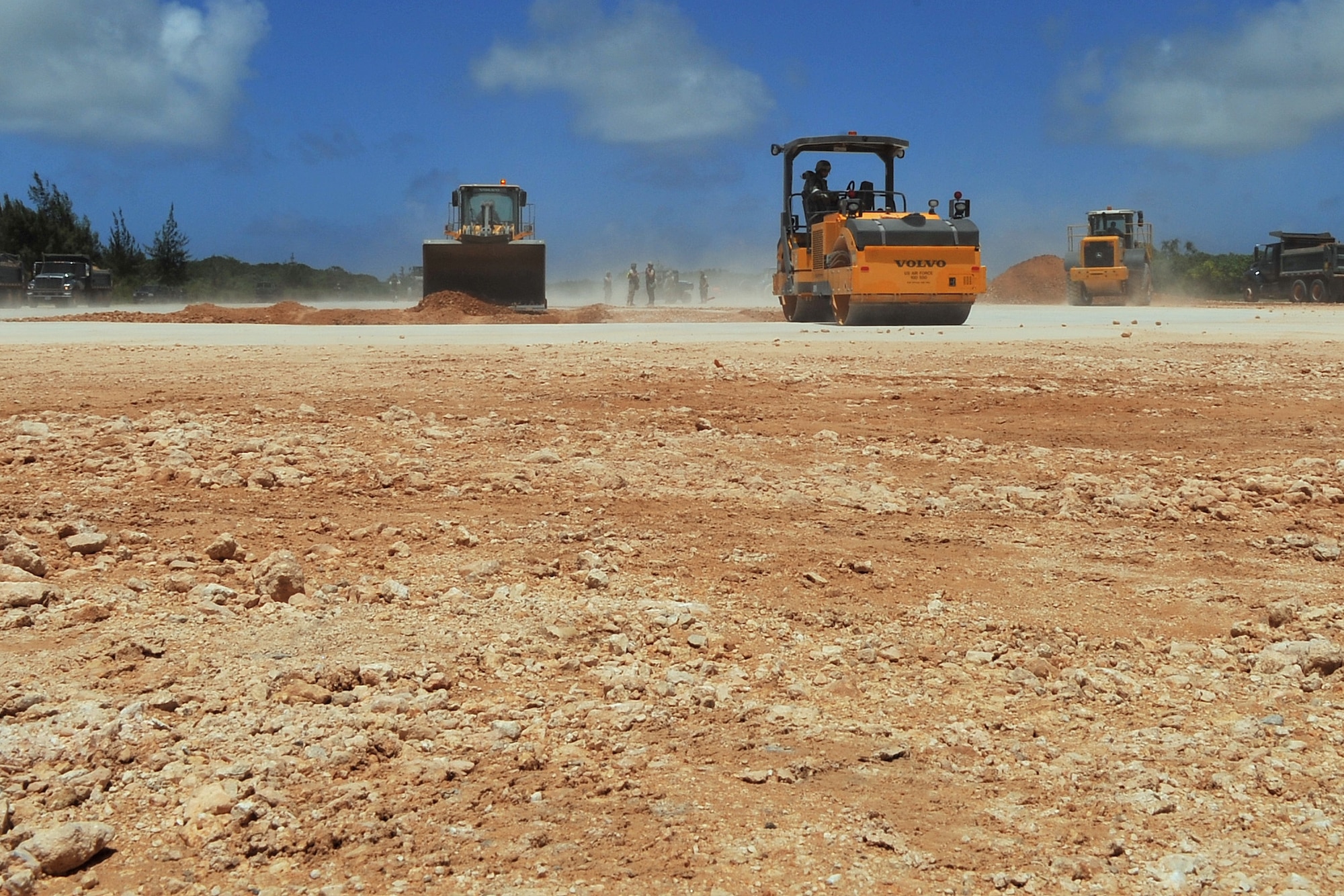 Pacific Air Forces civil engineer Airmen repair a crater during airfield damage repair training at the Pacific Air Forces’ Silver Flag site on Northwest Field, Guam, April 21, 2015. Airmen throughout PACAF participate in Silver Flag to exercise various expeditionary skills including ADR, where engineers provide a rapid, semi-permanent repair during combat operations to allow airfield operations to resume quickly. (U.S. Air Force photo by Staff Sgt. Melissa B. White/Released) 