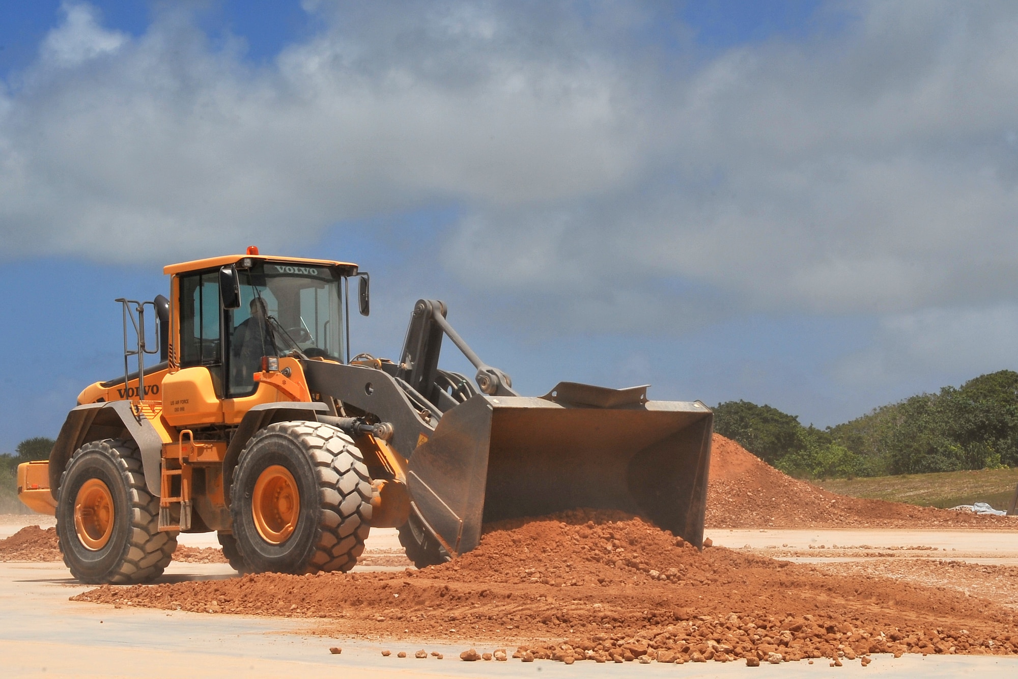 Staff Sgt. Bruce Green, 773rd Civil Engineer Squadron pavement and equipment operator, repairs a crater during airfield damage repair training at the Pacific Air Forces’ Silver Flag site on Northwest Field, Guam, April 21, 2015. Airmen throughout PACAF participate in Silver Flag to exercise various expeditionary skills including ADR, where engineers provide a rapid, semi-permanent repair during combat operations to allow airfield operations to resume quickly. Green is assigned to Joint Base Elmendorf-Richardson, Alaska. (U.S. Air Force photo by Staff Sgt. Melissa B. White/Released)