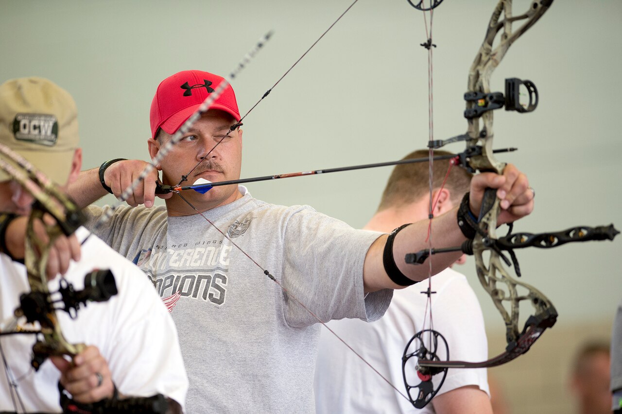Army Staff Sgt. Cory Davis takes aim during the archery competition of the Army Trials on Fort Bliss in El Paso, Texas, March 31, 2015. Athletes in the trials were competing for spots on the Army's team in the upcoming 2015 Department of Defense Warrior Games. DoD photo by EJ Hersom