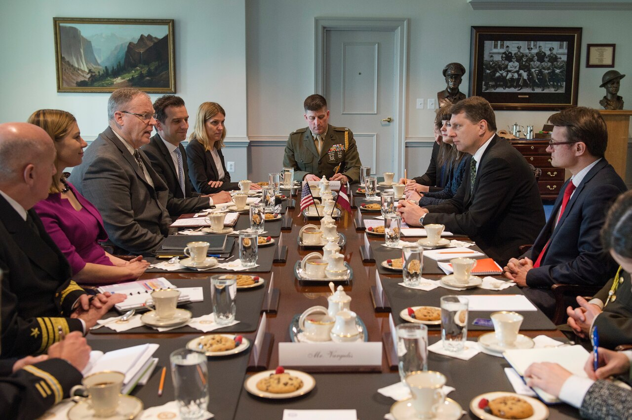 U.S. Deputy Defense Secretary Bob Work, third left, meets with Latvian Defense Minister Raimonds Vejonis, second right, at the Pentagon, April 23, 2015. The two defense leaders discussed matters of mutual importance. DoD photo by Air Force Master Sgt. Adrian Cadiz