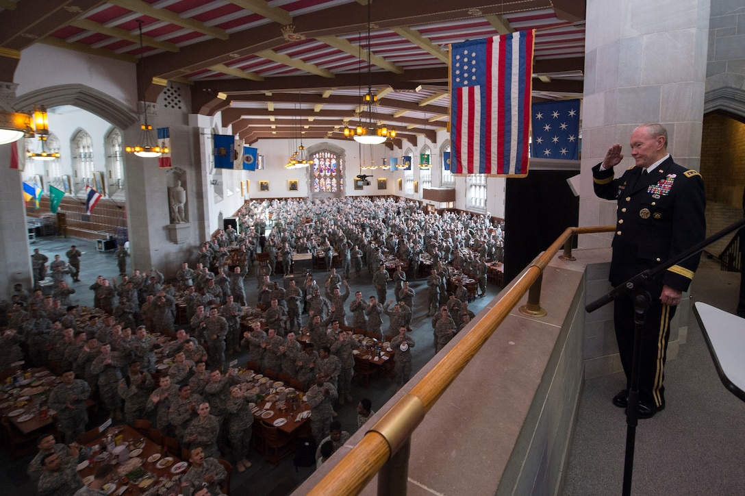Army Gen. Martin E. Dempsey, chairman of the Joint Chiefs of Staff, salutes cadets in the dining hall of the United States Military Academy at West Point, New York, April 22, 2014. Dempsey was on a two-day tour of the U.S. Naval Academy, U.S. Military Academy and Harvard University.
