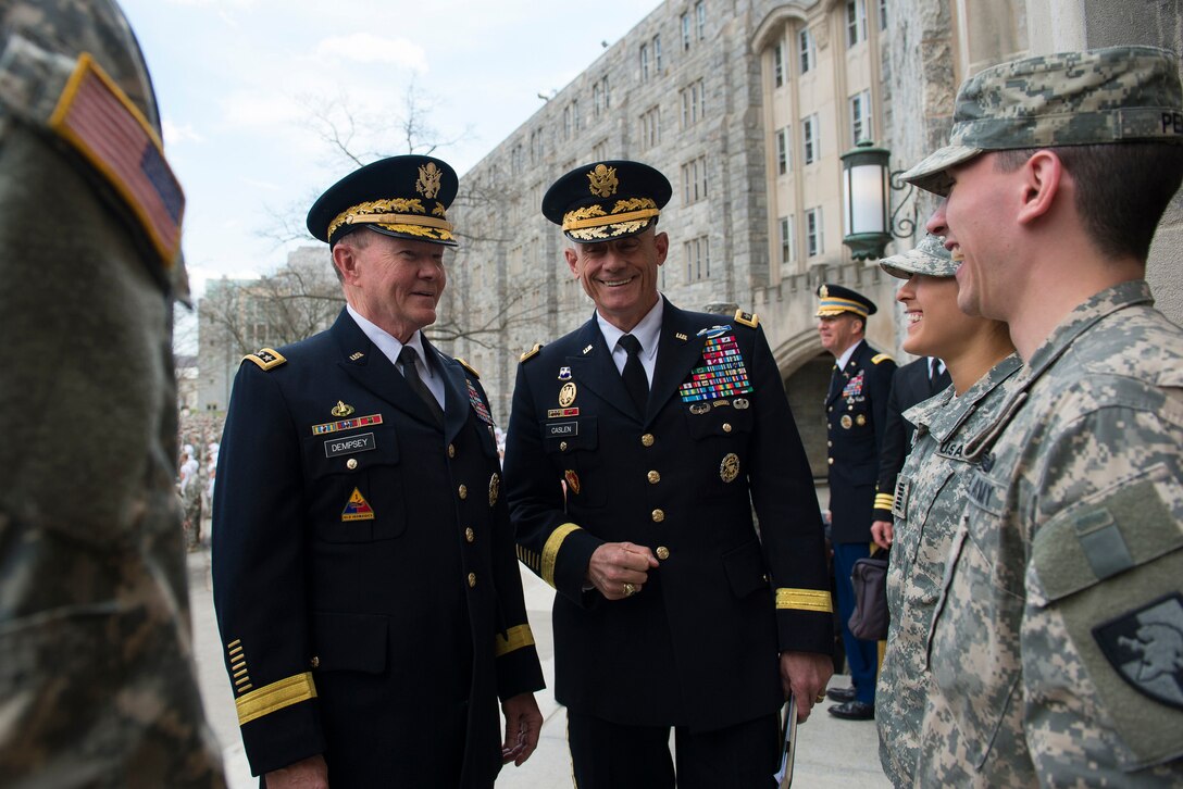 Army Gen. Martin E. Dempsey, left, chairman of the Joint Chiefs of Staff, and Superintendent of the U.S. Military Academy Army Lt. Gen. Robert L. Caslen Jr. talk with cadets during Dempsey's visit to the academy at West Point, N.Y., April 22, 2015. Dempsey was on a two-day tour of the U.S. Naval Academy, U.S. Military Academy and Harvard University. 