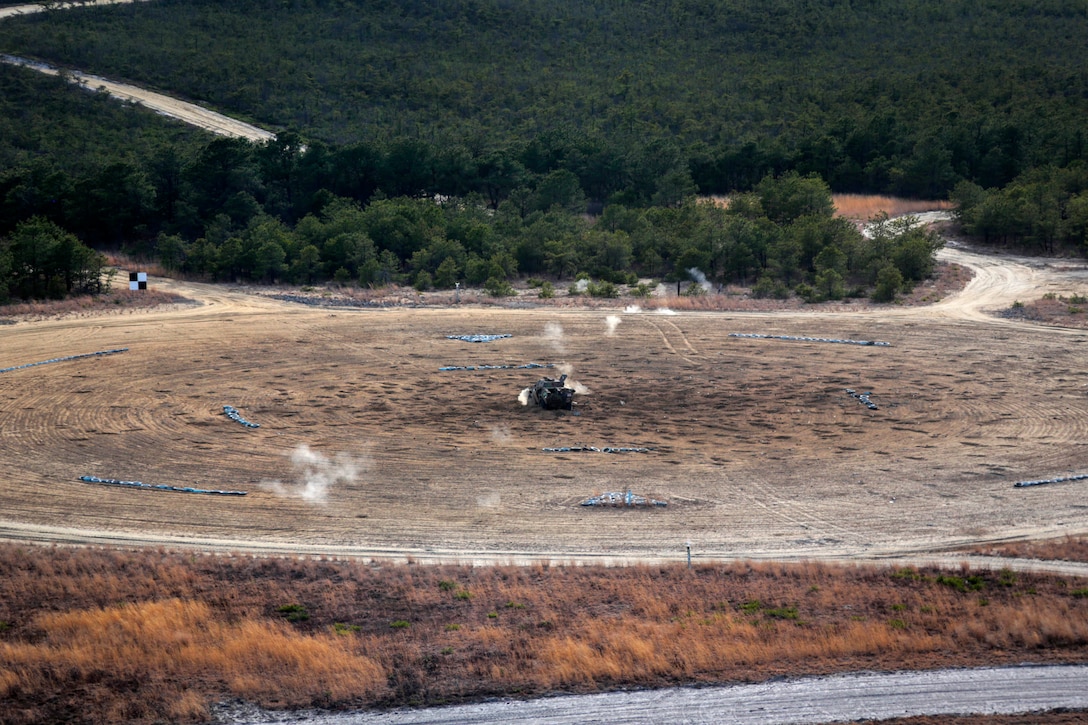 Bullet impacts from an M240 machine gun can be seen near targets at the Warren Grove Gunnery Range, N.J., April 16, 2015.