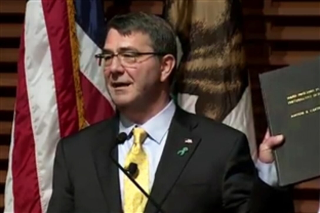 Defense Secretary Ash Carter delivers a lecture, "Rewiring the Pentagon: Charting a New Path on Innovation and Cybersecurity," at Stanford University in Stanford, Calif., April 23, 2015. The lecture highlighted the Pentagon's new cyber strategy and innovation initiatives. In his introductory remarks, Carter held up a copy of his doctoral thesis.