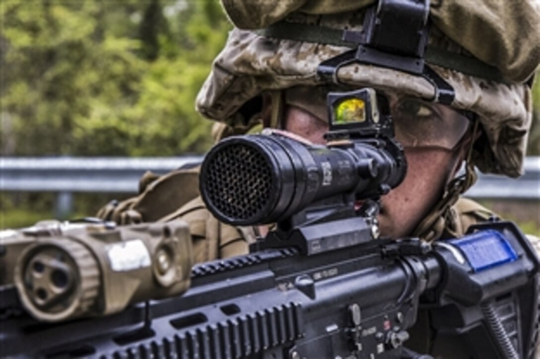 Marine Pfc. Jesse Owings posts security during a patrol to identify improvised explosive devices on Marine Corps Base Camp Lejeune, N.C., April 15, 2015. Owings is a rifleman assigned to the 2nd Marine Division's 1st Battalion, 6th Marine Regiment. 
