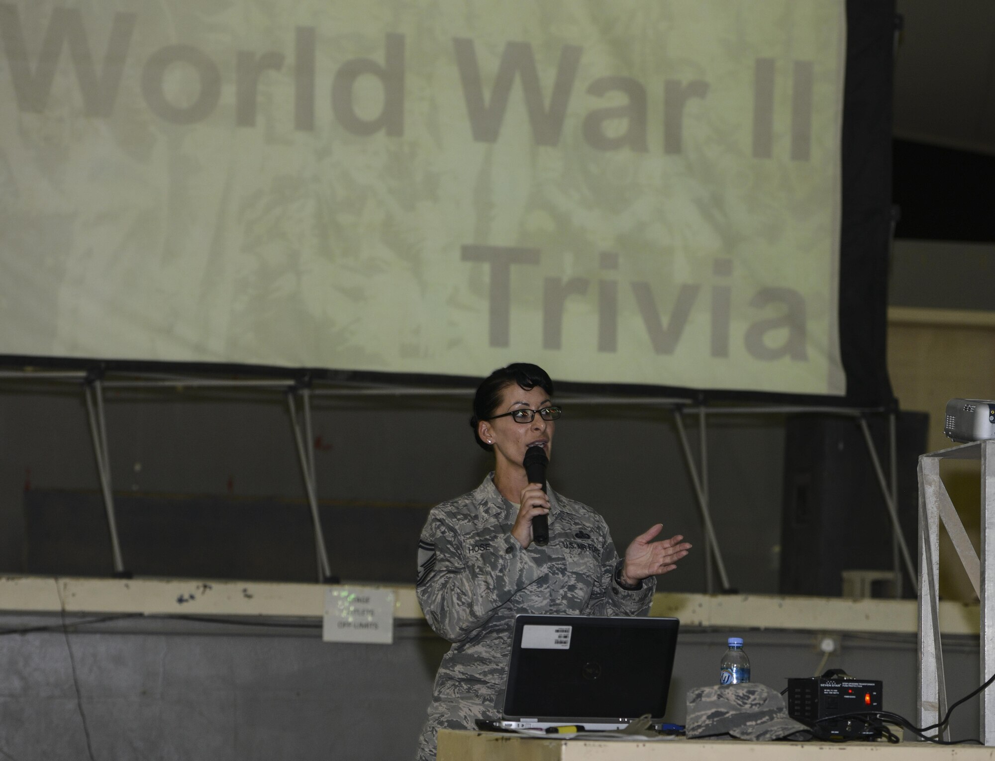 Senior Master Sgt. Turaeza Hose, 379th Expeditionary Forces Support Squadron community services flight superintendent, announces the start of the World War II Trivia April 17, 2015 at Memorial Plaza, Al Udeid Air Base, Qatar.  The night was held in remembrance of the 73rd anniversary of the Doolittle Tokyo Raid that occurred April 18, 2015. The evening began with trivia, a short video depicting the historical moment, and a toast held in their honor. (U.S. Air Force photo by Tech. Sgt. Douglas)