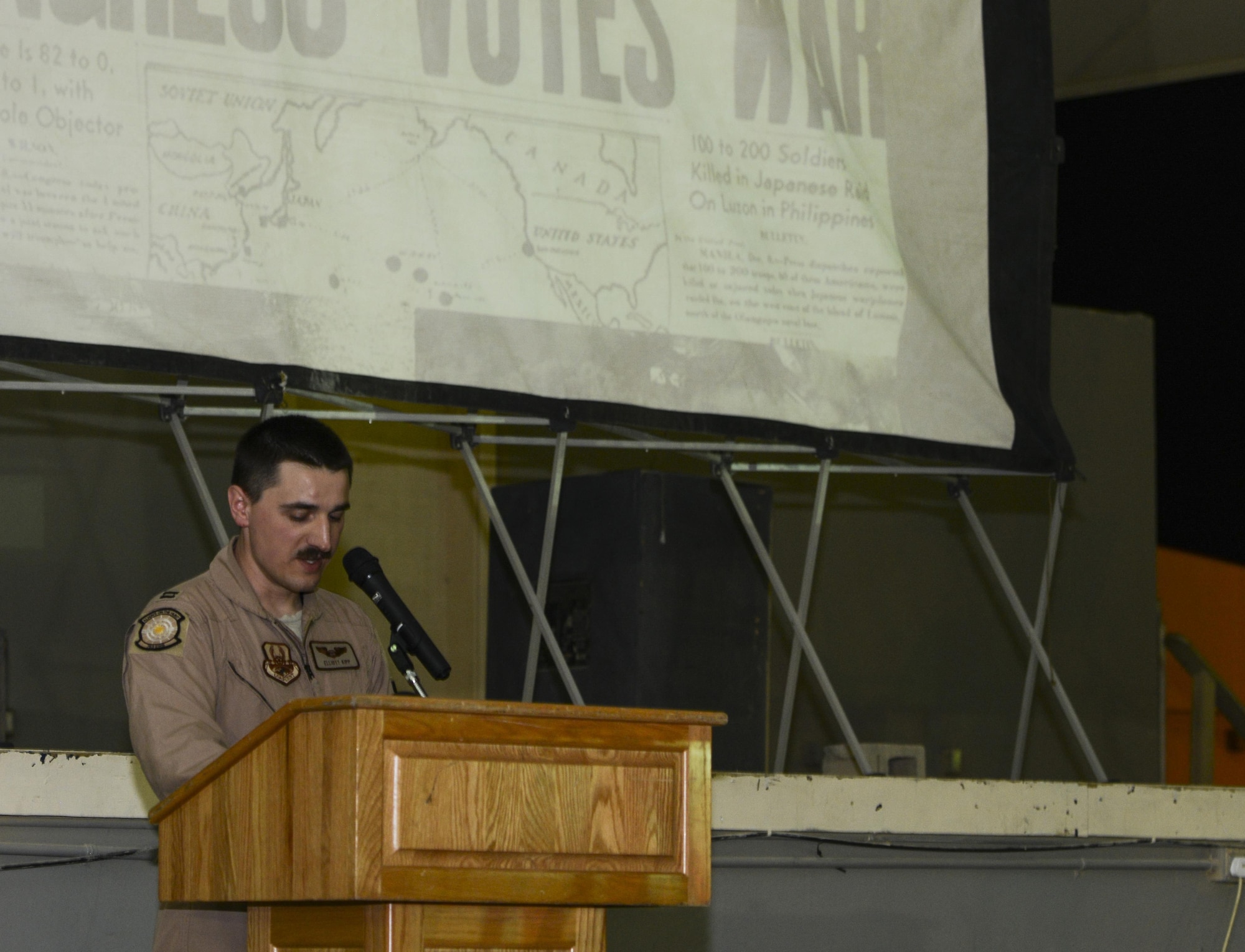 Capt. Elliot Kipp, 763rd Expeditionary Squadron electronic warfare officer, speaks to the crowd about the events that surrounded the Doolittle Tokyo Raid April 17, 2015 at Memorial Plaza at Al Udeid Air Base, Qatar. The night was held in remembrance of the 73rd anniversary of the Doolittle Tokyo Raid that occurred April 18, 1942. Kipp was asked to speak during the occasion because his home unit is the 95th Reconnaissance Squadron. The 95 RS was formerly known as the 95th Bomb Squadron, which was part of the Doolittle Raiders.
