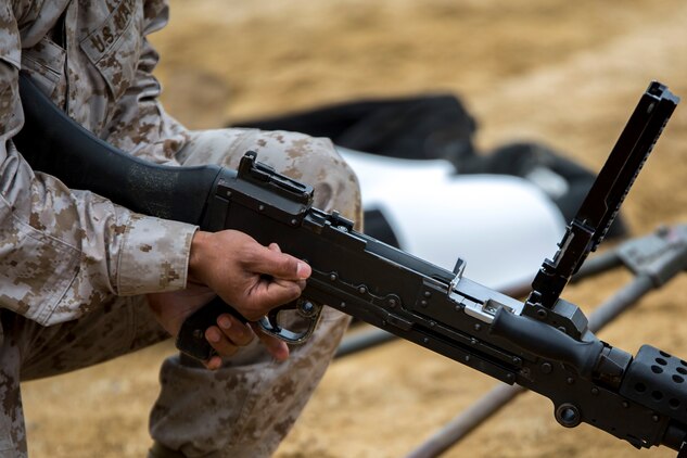 Staff Sgt. Nigel Hinds, the truck master for Marine Wing Support Squadron 171, Motor Transport Company, performs a functions check on an M240 bravo machine gun at the Japan Ground Self-Defense Force’s Haramura Maneuver Area in Hiroshima, Japan, April 12, 2015, as part of Exercise Haramura 1-15. Haramura is a weeklong company-level training event focused on reinforcing the skills Marines learned during Marine Combat Training and their Military Occupational Specialty school.