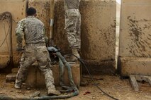 U.S. Air Force Staff Sgt. Andrew Modesto, a Water and Fuel system specialist attached to the 577th Expeditionary Prime Base Emergency Engineering Force Squadron, loosens a water pipe as part of his mission to assess the capability of the well for emergency water supply for the Operation Inherent Resolve Building Partner Capacity Mission aboard Al-Asad Airbase, Iraq, April 11, 2015. The BPC mission will train and enable Iraqi Security Force leadership skills, medical procedures, small unit tactics, air-ground integration, and equipping and sustainment procedures. (U.S. Marine Corps Photo by Cpl. Cansin P. Hardyegritag)