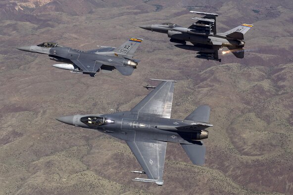 F-16 Fighting Falcons from the Arizona Air National Guard's 162nd Wing in Tucson fly over an eastern Arizona training range April 8, 2015. The 162nd Wing conducts international F-16 pilot training and manages a fleet of more than 70 F-16 C/D and Mid-Life Update Fighting Falcons. (U.S. Air Force photo/Master Sgt. Jeffrey Allen)