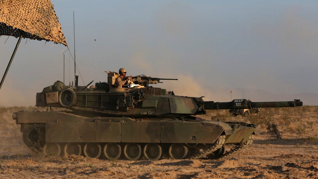 Marines with Company A, 1st Tank Battalion, 1st Marine Division, nicknamed “America’s Company,” put their M1A1 abrams main battle tank into a defensive position during Exercise Desert Scimitar aboard Marine Corps Air Ground Combat Center Twentynine Palms, California, April 11, 2015. The training gave the Marines the opportunity to refine and rehearse essential combat skills needed in a battlefield environment. Desert Scimitar is an annual exercise that includes elements from the I Marine Expeditionary Force. The exercise focused on conventional operations and provided realistic training that prepared Marines for overseas operations. (U.S. Marine Corps photo by Sgt. Christopher J. Moore/Released)