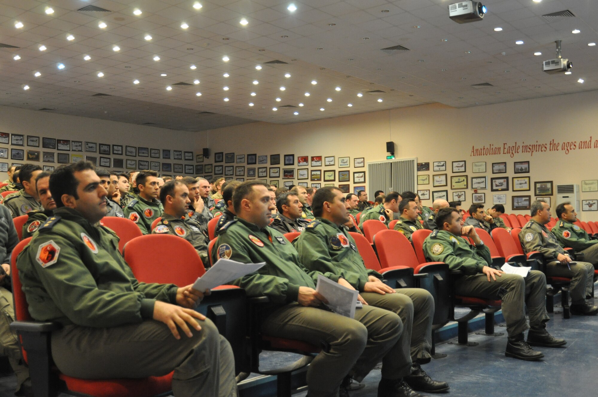 ISIK participants attend a pre-mission brief April 6, 2015, at the 3rd Main Jet Base in Konya, Turkey. ISIK, an international combat search and rescue event hosted by the Turkish armed forces, includes participants from the United States, Spain, Romania, Hungary and Azerbaijan. (U.S. Air Force photo by Capt. Laura Balch)