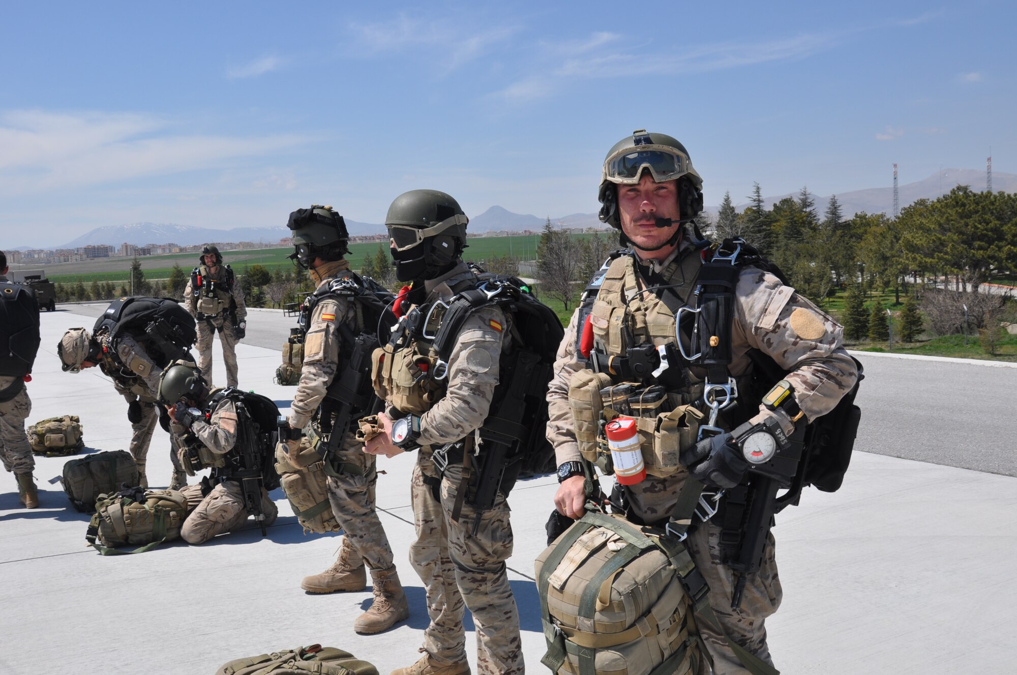 Spanish air force EZAPAC members prepare to board a U.S. Air Force MC-130J Commando II aircraft in order to conduct a military free fall jump April 6, 2015, at the 3rd Main Jet Base in Konya, Turkey. The jump was part of ISIK, an international combat search and rescue event, which includes training scenarios that focus on personnel recovery and airfield establishment and control skillsets. (U.S. Air Force photo by Capt. Laura Balch)
