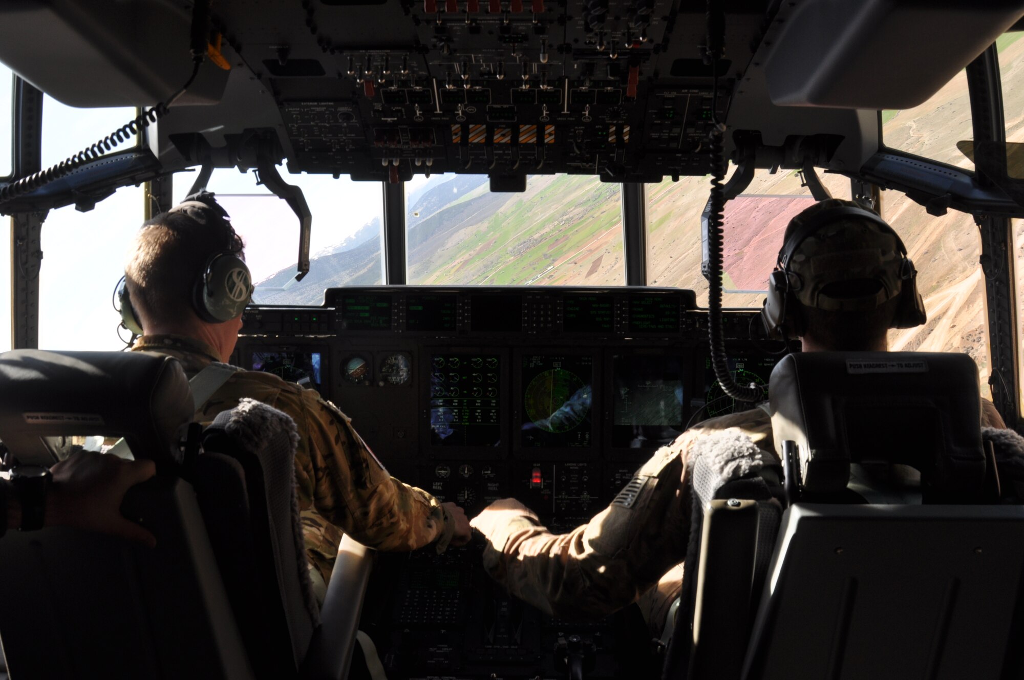 A U.S. Air Force pilot and copilot perform low-level maneuvers in an MC-130J Commando II April 6, 2015, during ISIK, an international combat search and rescue event, while flying over Konya, Turkey. The purpose of this two-week CSAR event is to highlight the interoperability among the participating nations' special operations and conventional forces. (U.S. Air Force photo by Capt. Laura Balch)