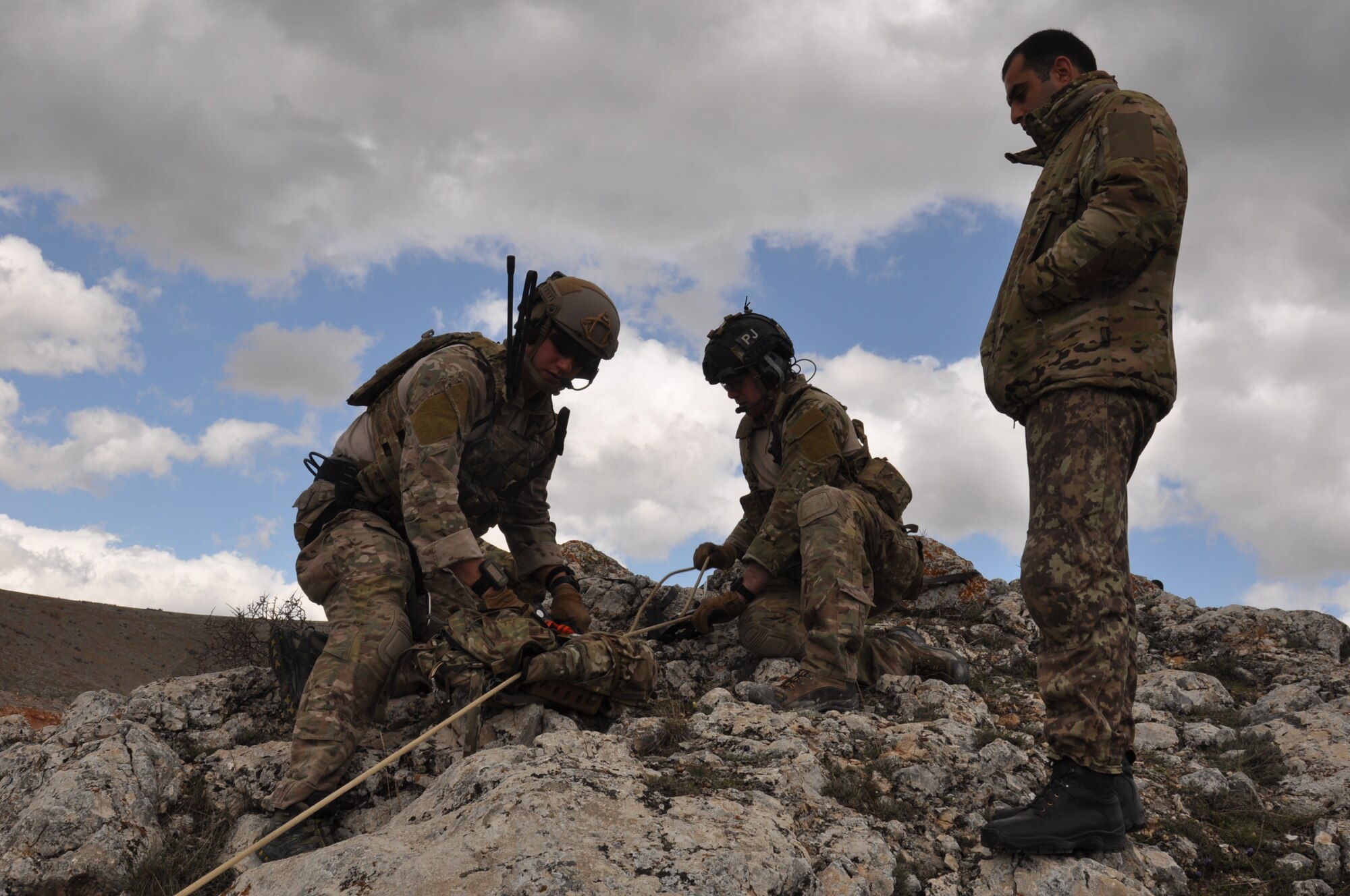 Spanish air force members observe while a U.S. Air Force combat search and rescue team determines a plan to reach a simulated downed pilot April 7, 2015, during ISIK, an international CSAR event, in Konya, Turkey. Personnel recovery scenarios can utilize a variety of tactics and techniques including planning and executing mountain and water rescues as well as survival, evasion, resistance and escape situations. (U.S. Air Force photo by Capt. Laura Balch)